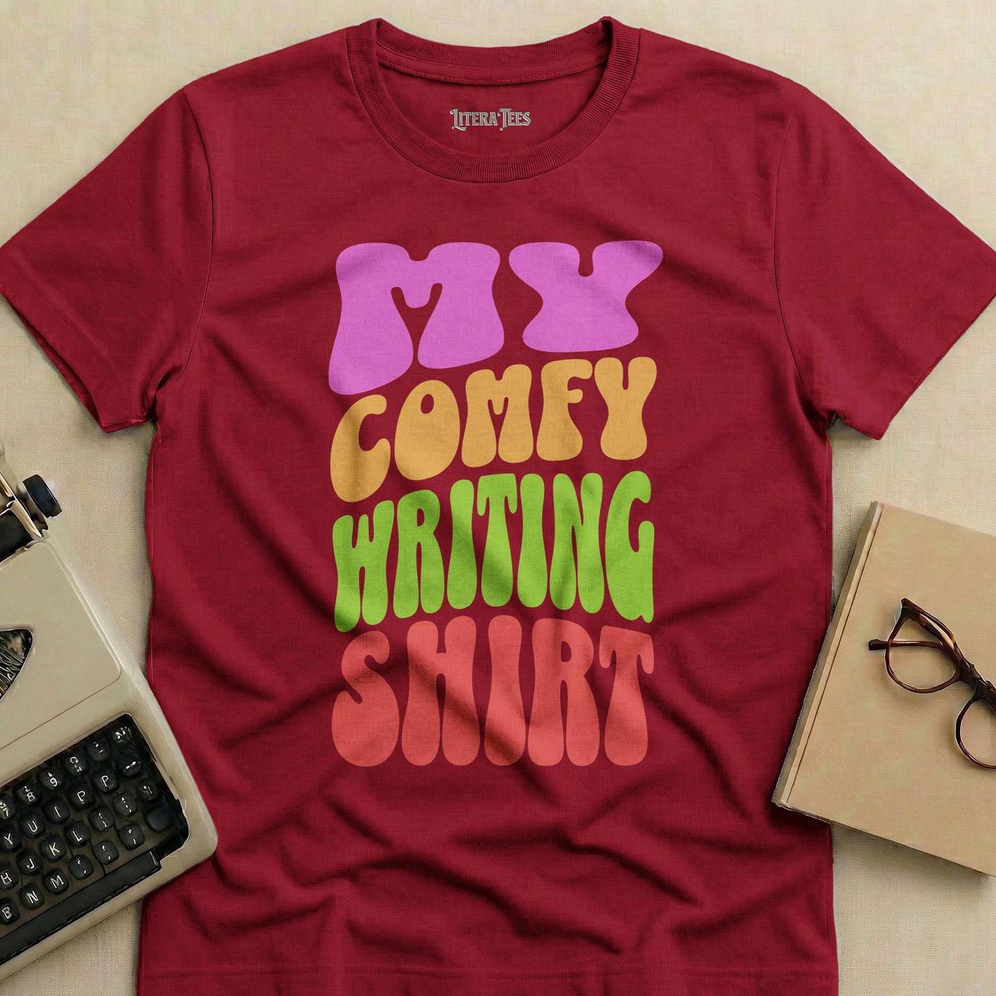 Maroon t-shirt with "My Comfy Writing Shirt" in colorful, wavy letters.