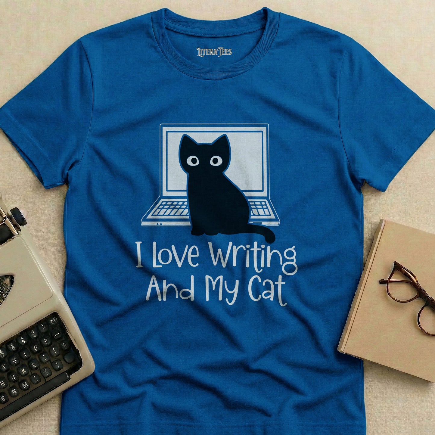 Blue t-shirt with a cat at a laptop and "I Love Writing And My Cat" text.
