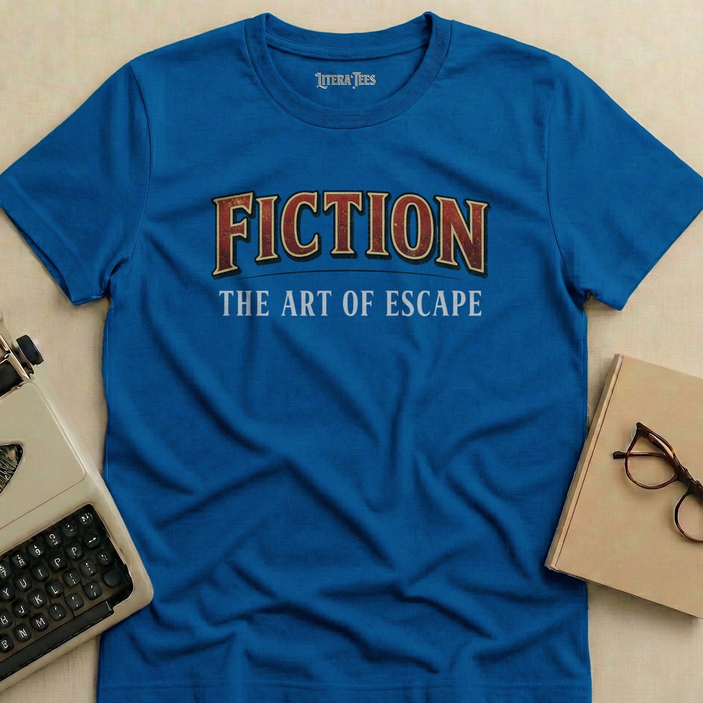 Blue t-shirt with "FICTION THE ART OF ESCAPE" text.