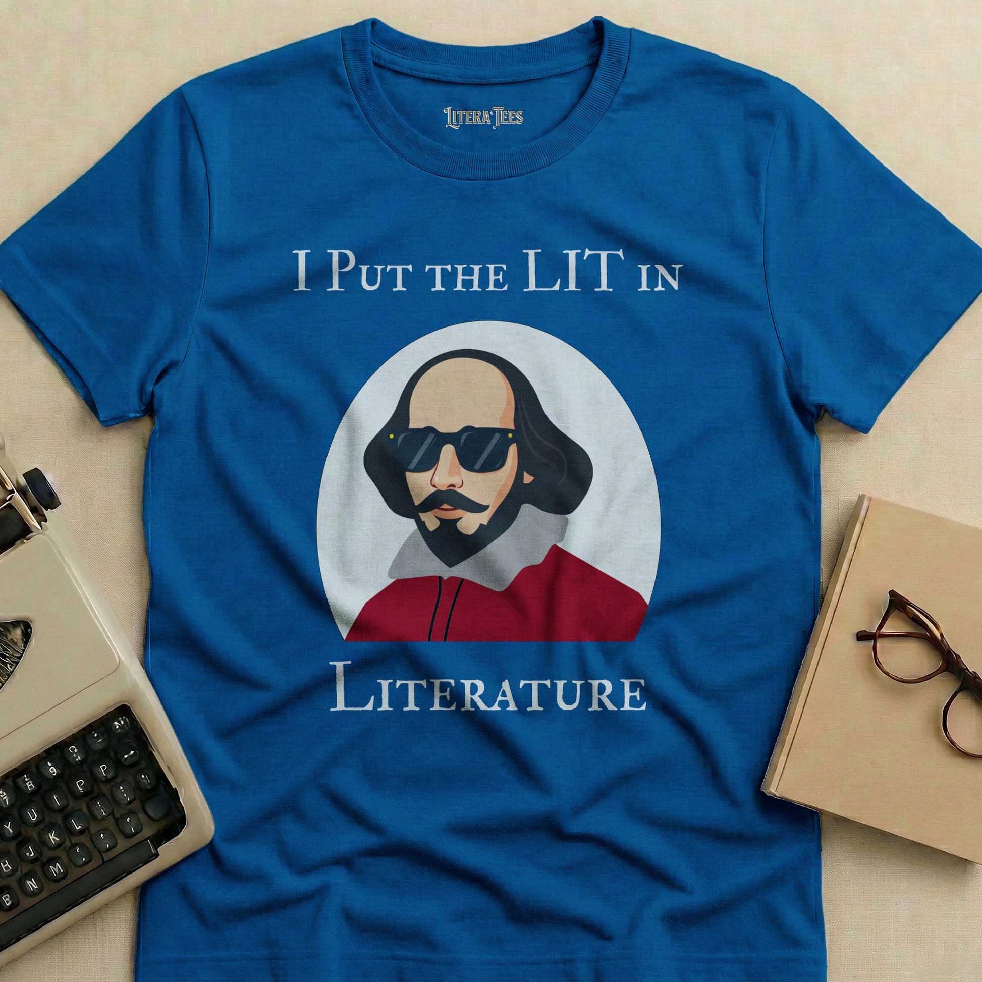 Blue t-shirt with Shakespeare graphic and text "I PUT THE LIT IN LITERATURE".