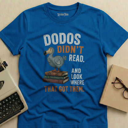 Blue t-shirt with "Dodos Didn't Read" graphic and text.