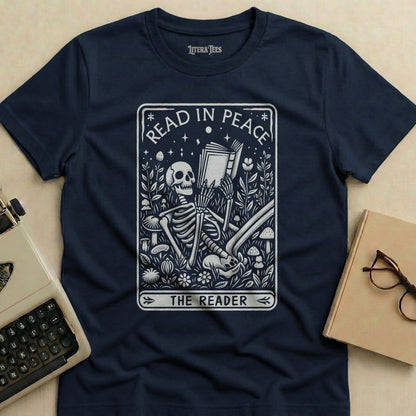 Dark blue t-shirt with "Read in Peace The Reader" skeleton graphic.