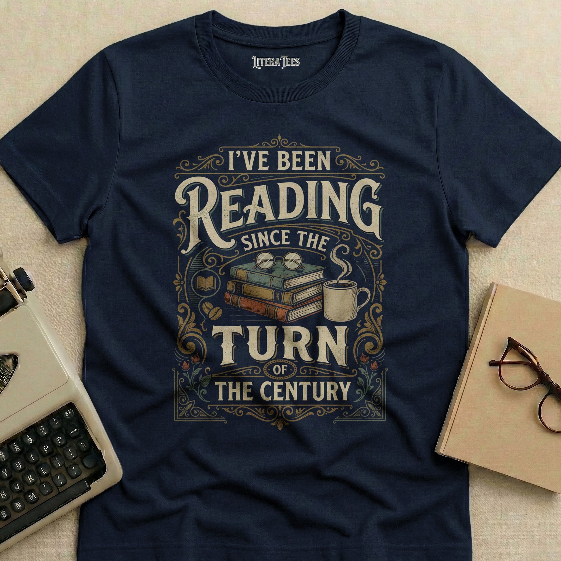 Navy t-shirt with "I've Been Reading Since the Turn of the Century" text and book graphics.