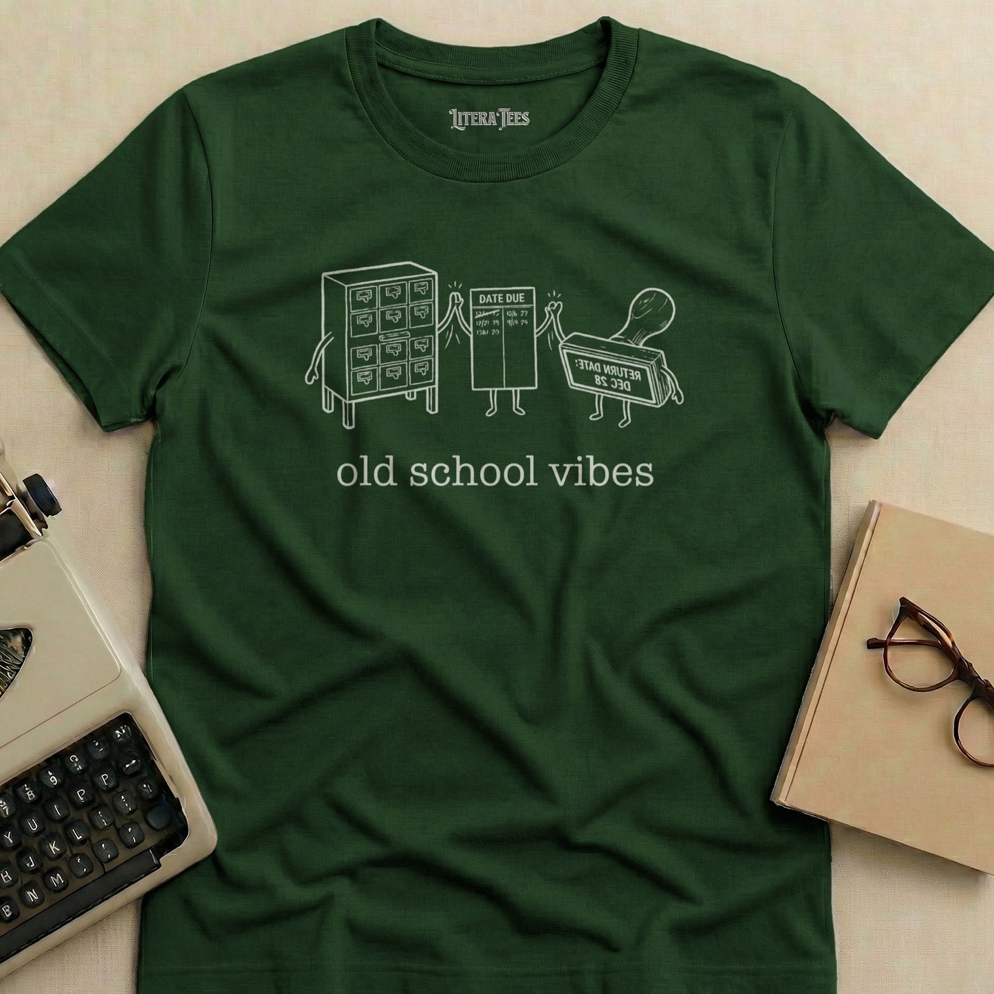 Green t-shirt with "old school vibes" and library card illustration.