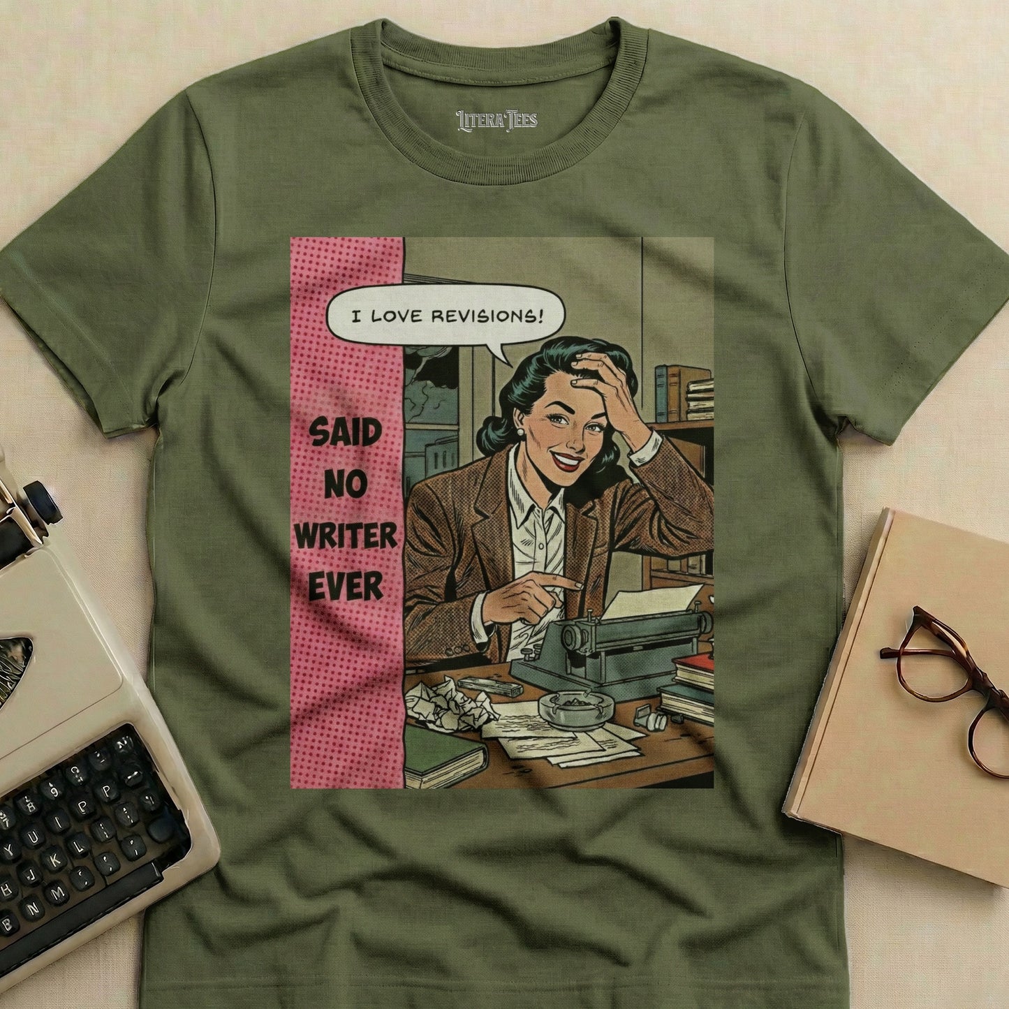 Green t-shirt with comic-style illustration of a writer and text "I LOVE REVISIONS! SAID NO WRITER EVER."