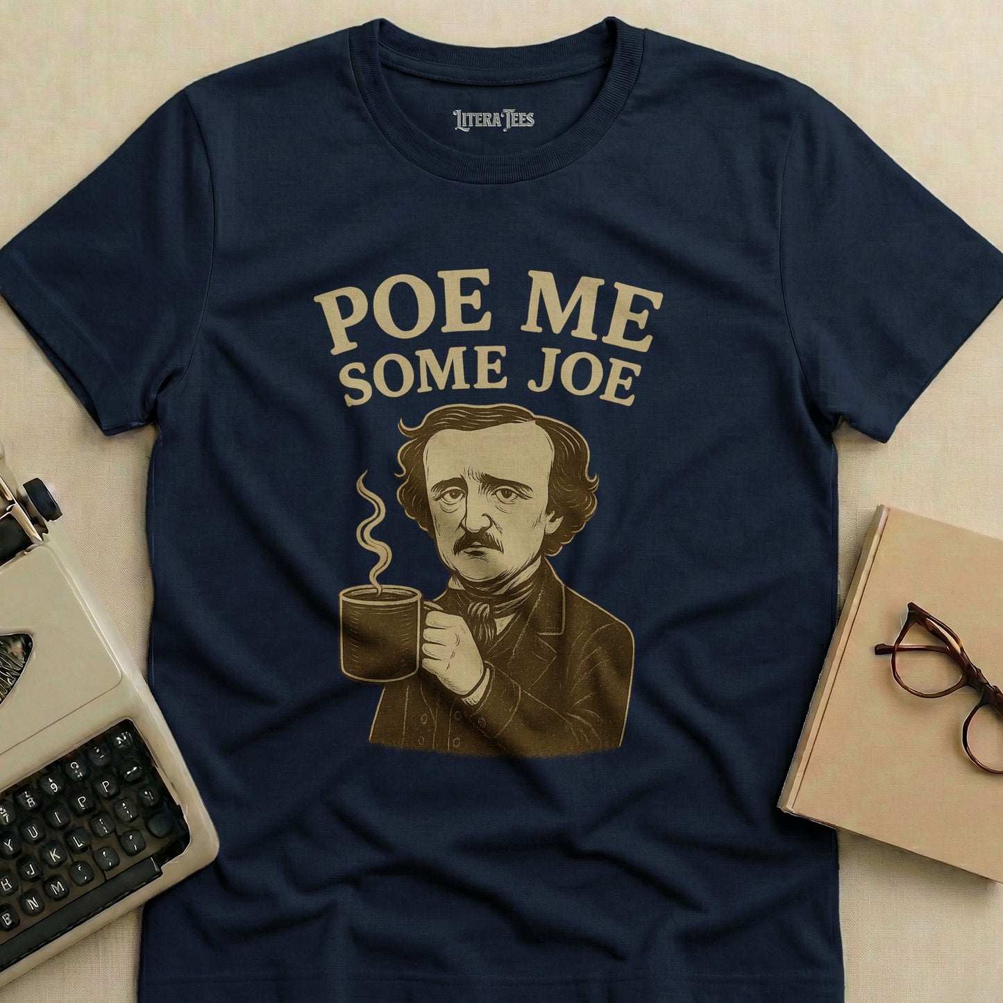 Edgar Allan Poe graphic on a navy t-shirt with "Poe Me Some Joe" text.