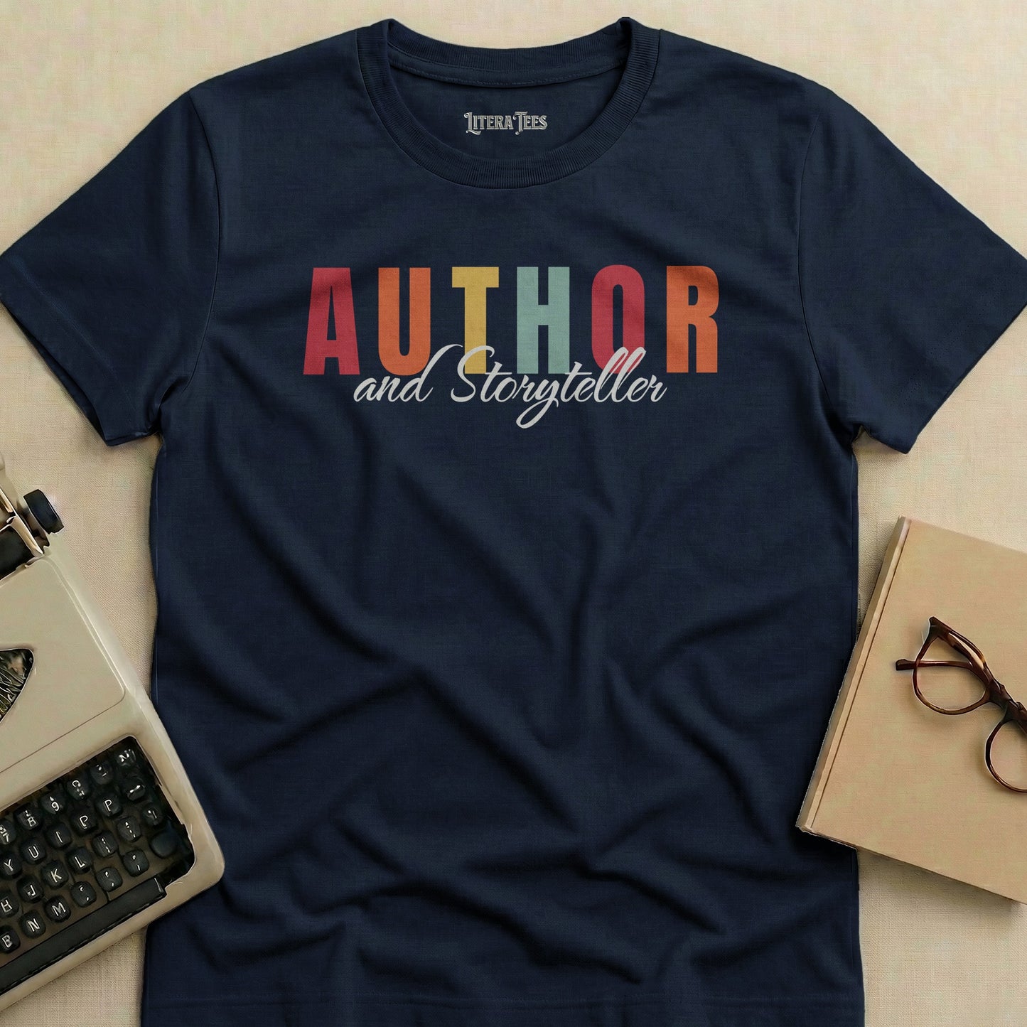 Dark blue t-shirt with "AUTHOR and Storyteller" text in colorful block letters.
