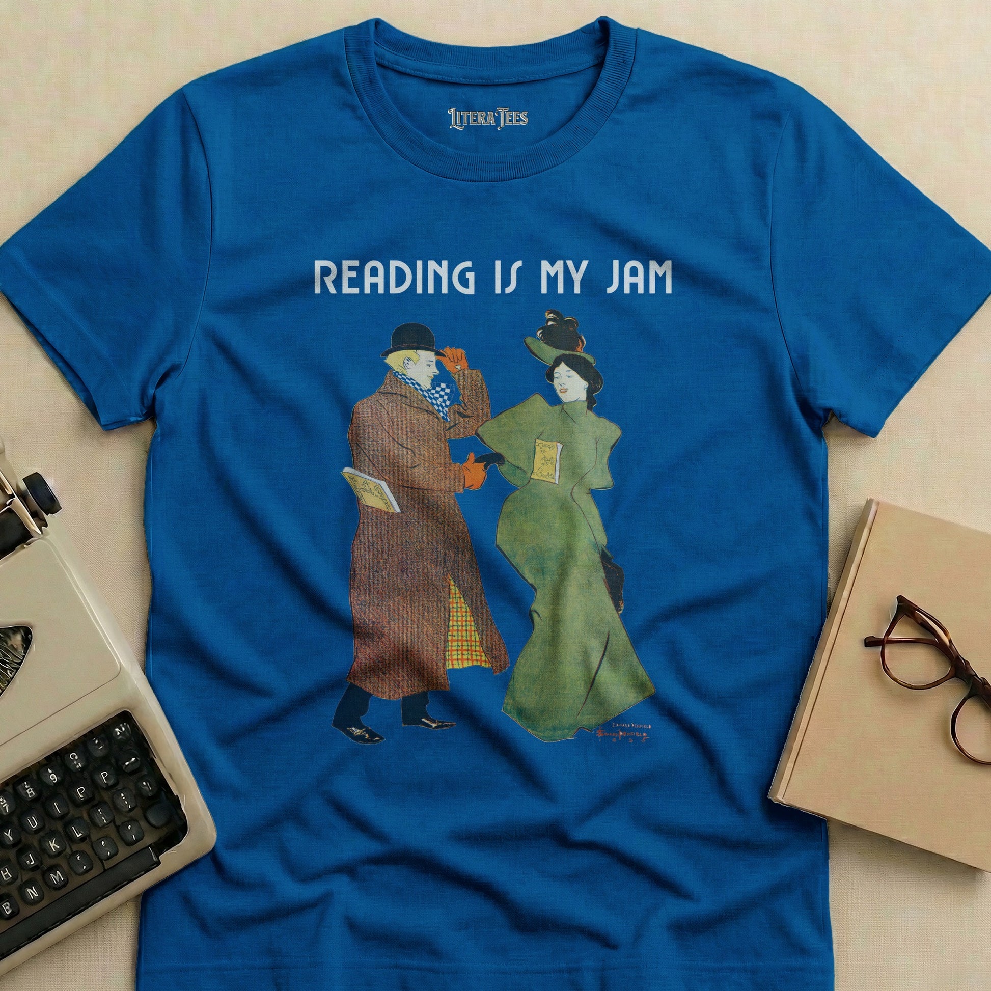 Blue t-shirt with "READING IS MY JAM" and illustration of two people reading.
