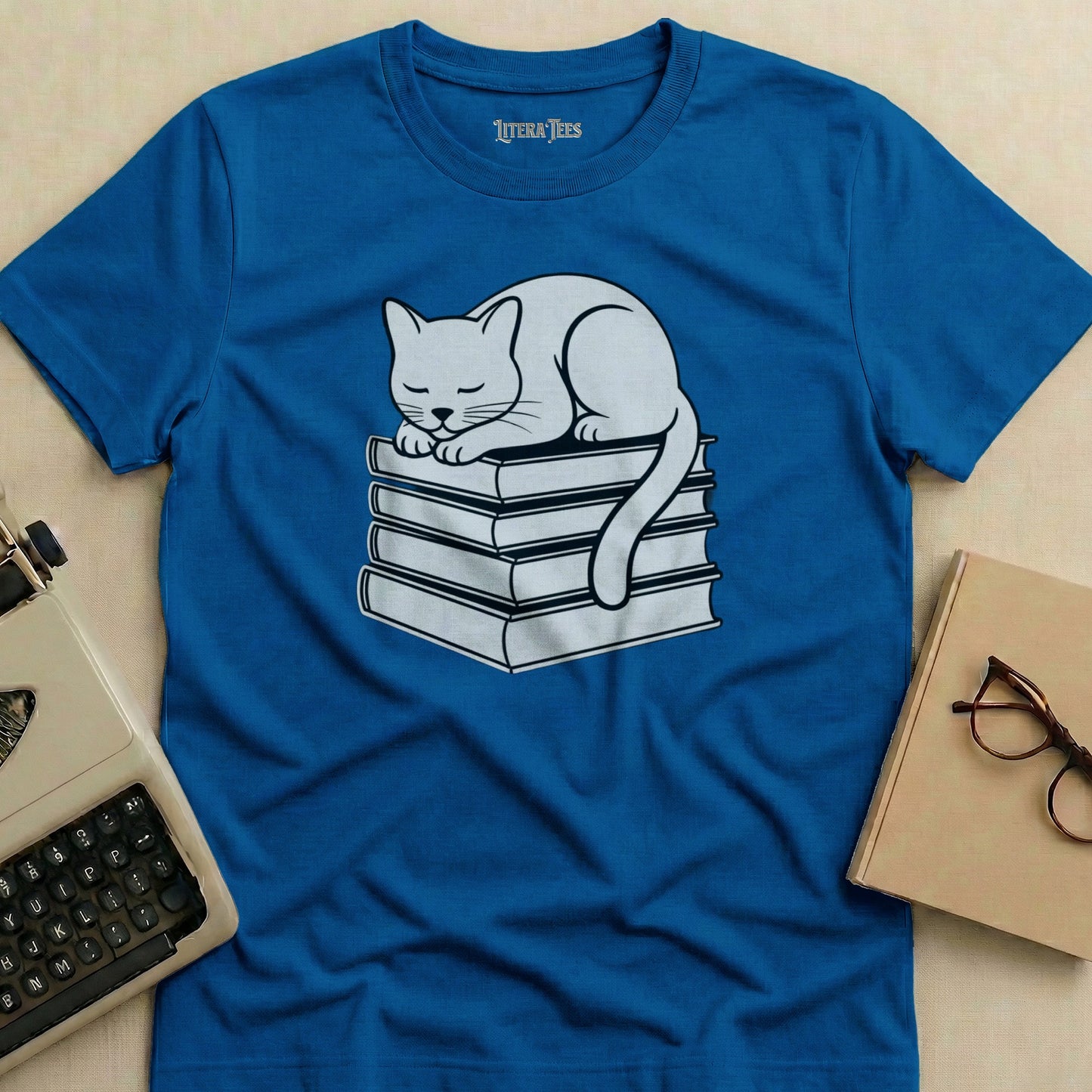 White cat sleeping on a stack of books, Literatees logo.