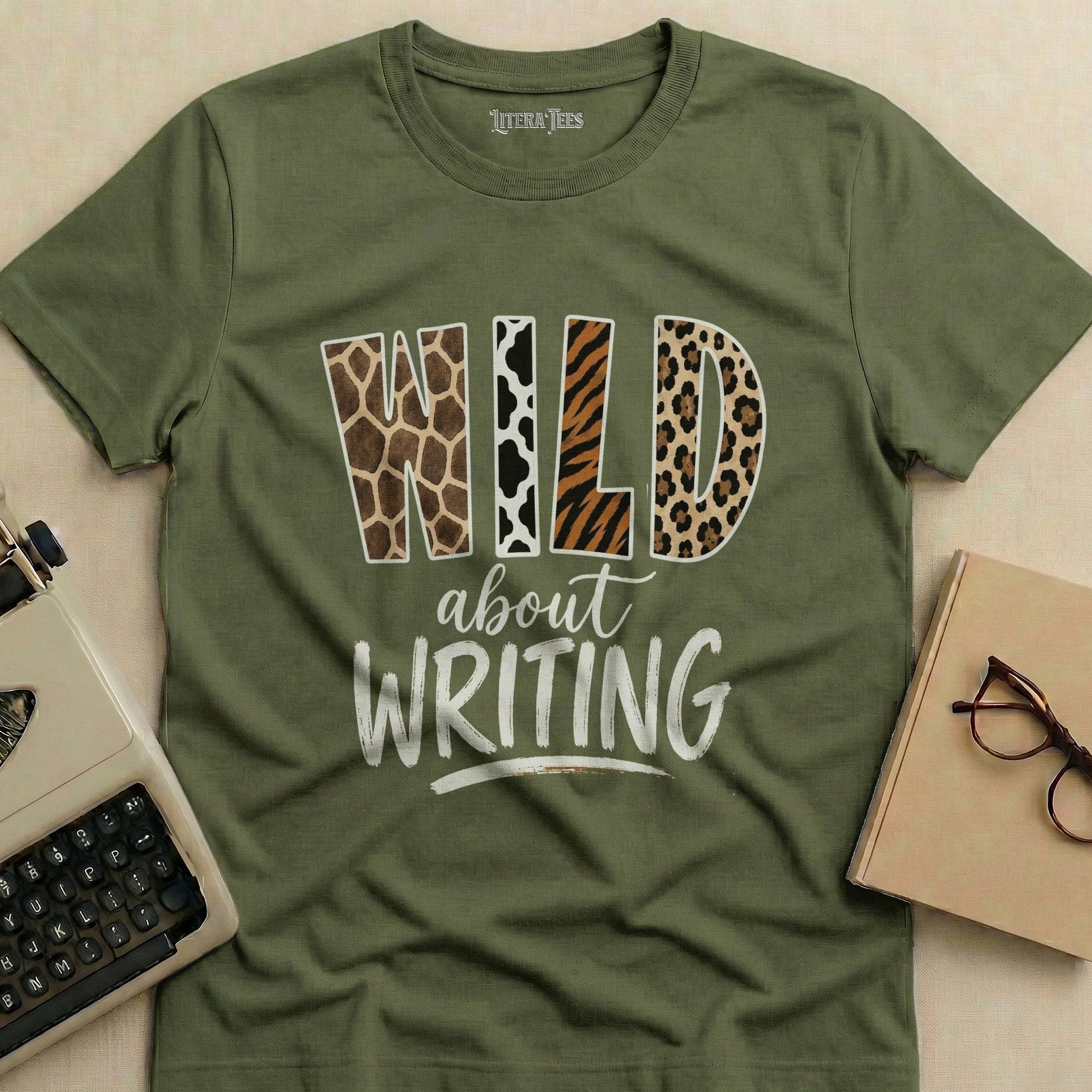 Green t-shirt with "Wild about Writing" text in animal print fonts.