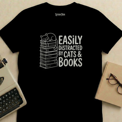 Black t-shirt with "Easily Distracted by Cats & Books" text and a sleeping cat.