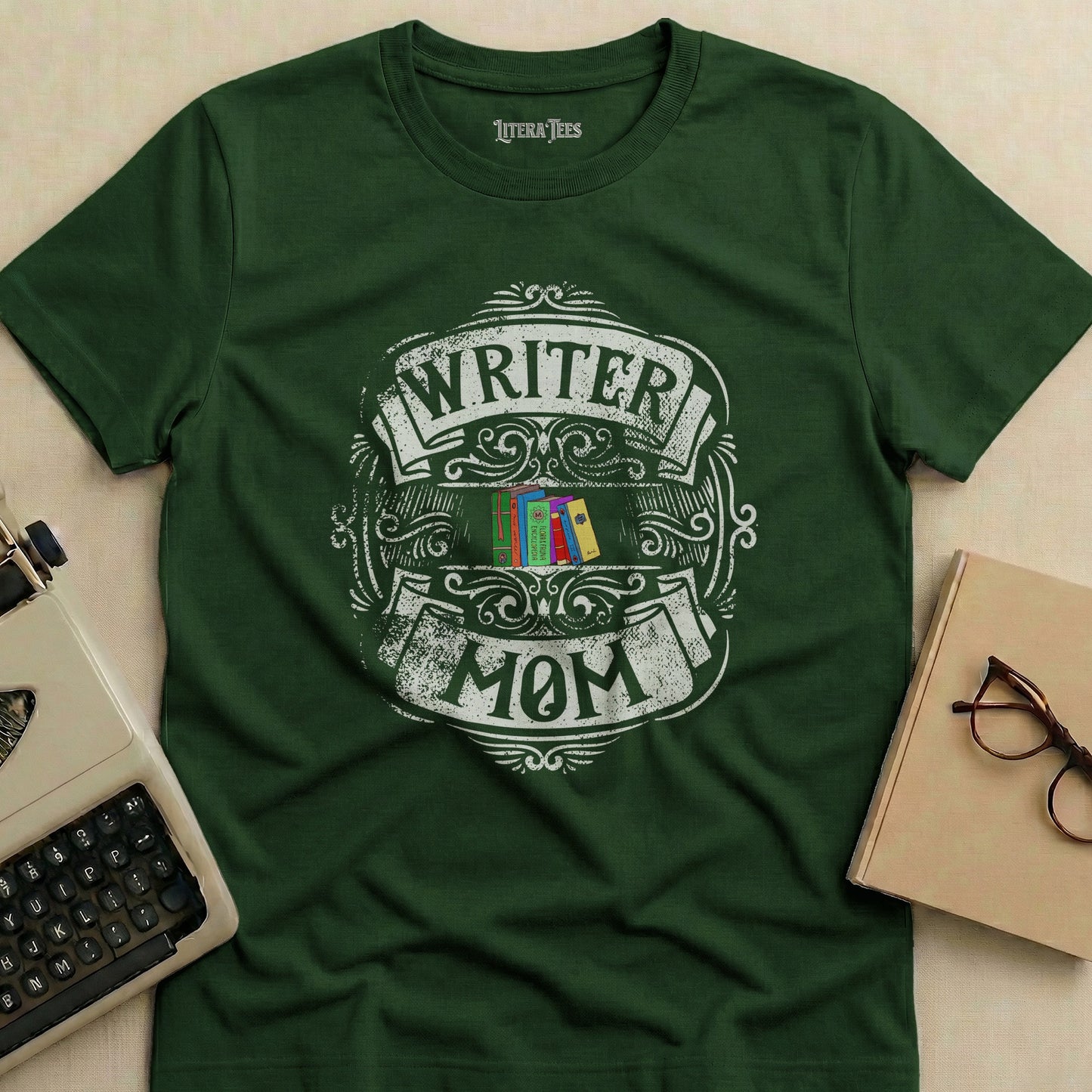 Green t-shirt with "Writer Mom" design featuring books and vintage flourishes.