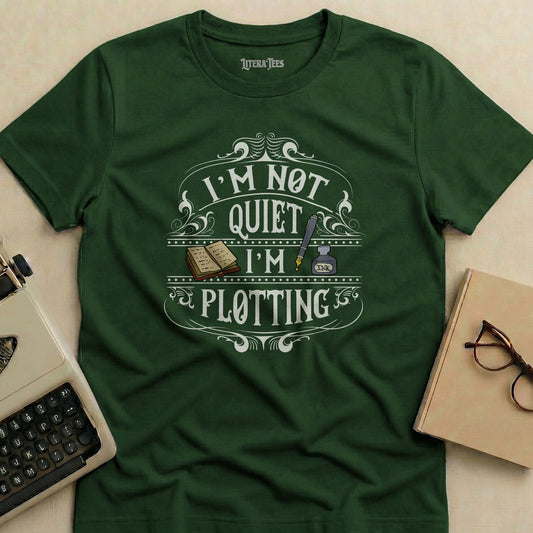 Dark green t-shirt with "I'M NOT QUIET I'M PLOTTING" text.