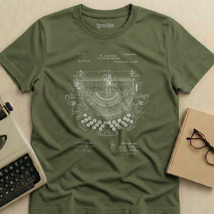 Olive green t-shirt with vintage typewriter patent diagram and "LITERA TEES" text.