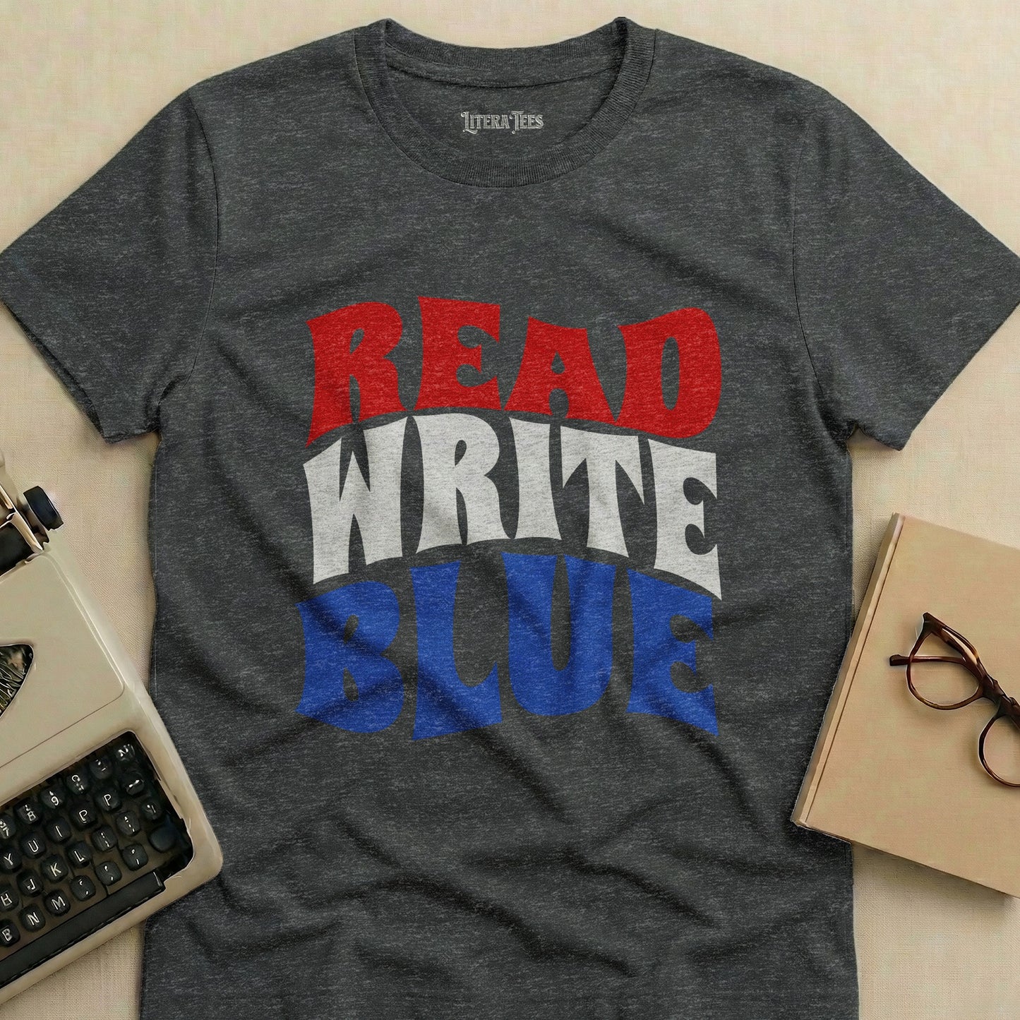 Dark grey t-shirt with "READ WRITE BLUE" in red, white, and blue text.