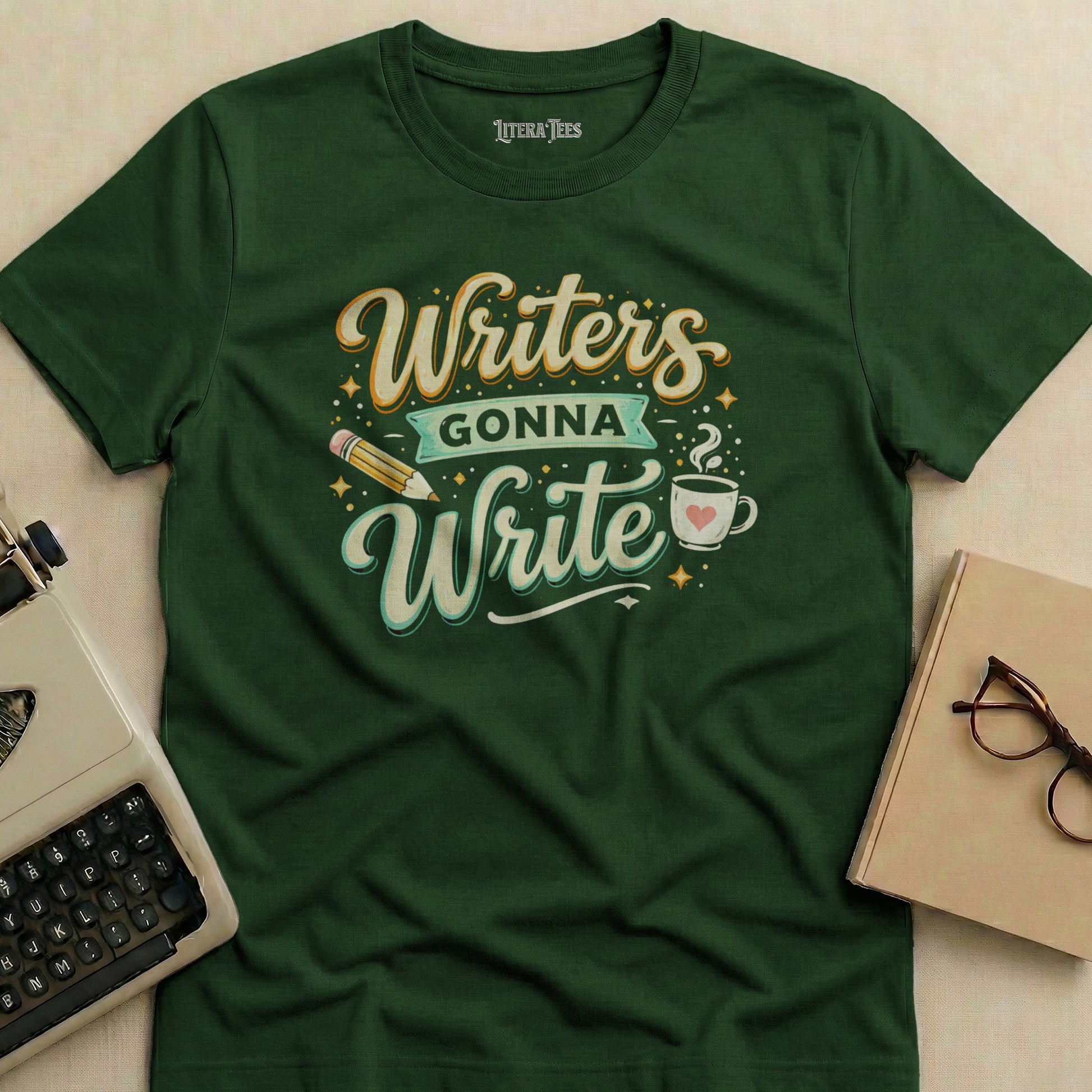 Green t-shirt with "Writers Gonna Write" text, pencil, and coffee cup graphic.