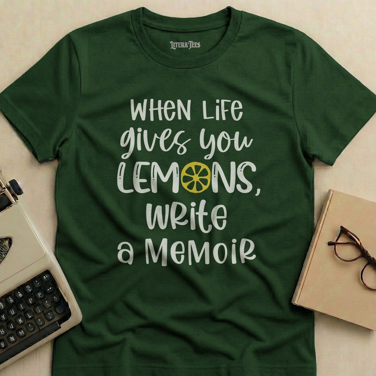 Dark green t-shirt with "When Life Gives You Lemons, Write a Memoir" text.