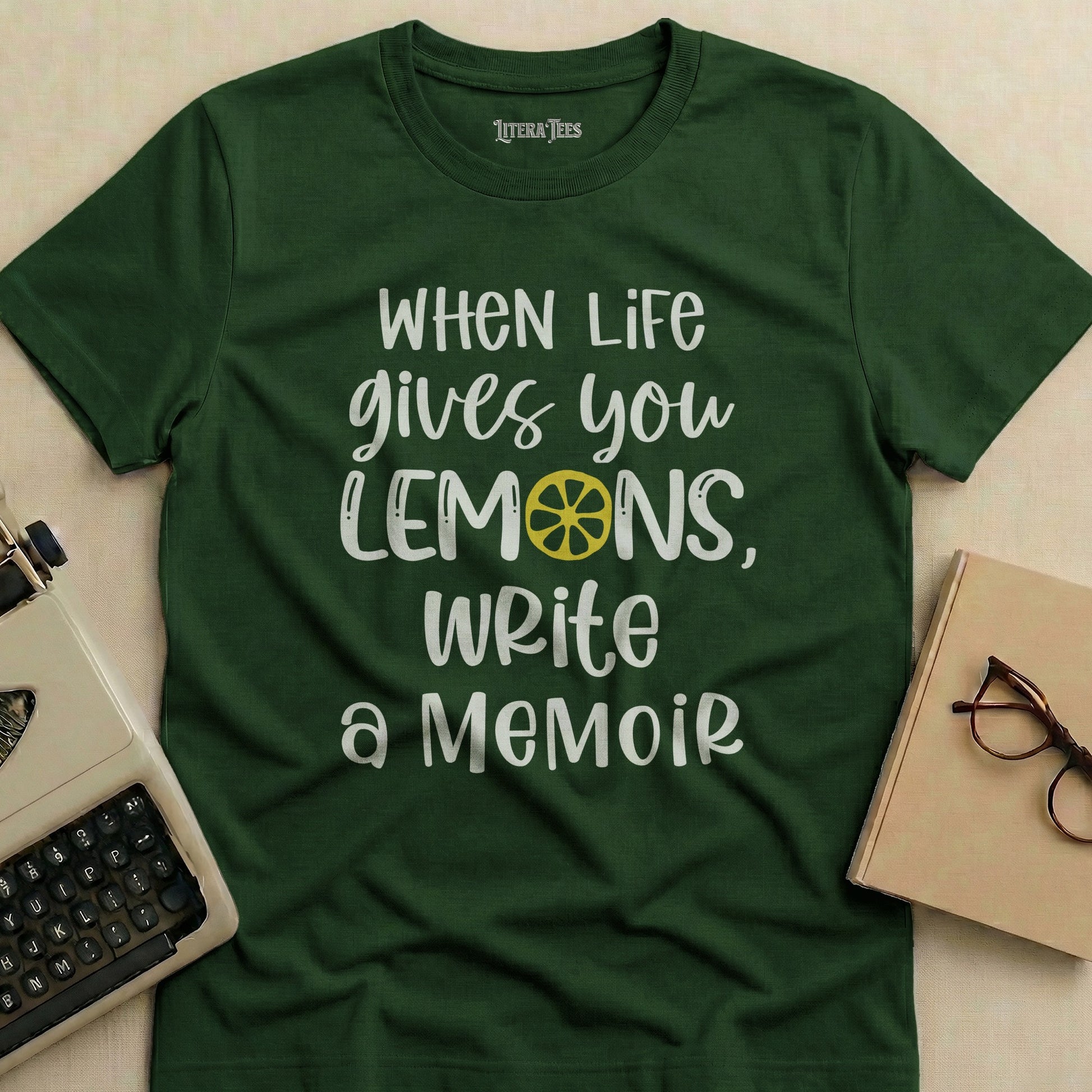 Dark green t-shirt with "When Life Gives You Lemons, Write a Memoir" text.