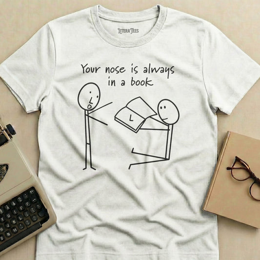 White t-shirt with stick figures reading a book, "Your nose is always in a book".