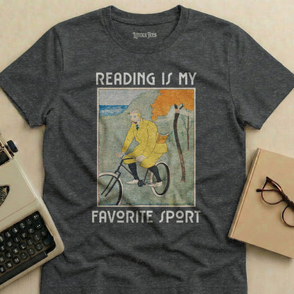 Dark t-shirt with "Reading is my favorite sport" and a man on a bicycle.