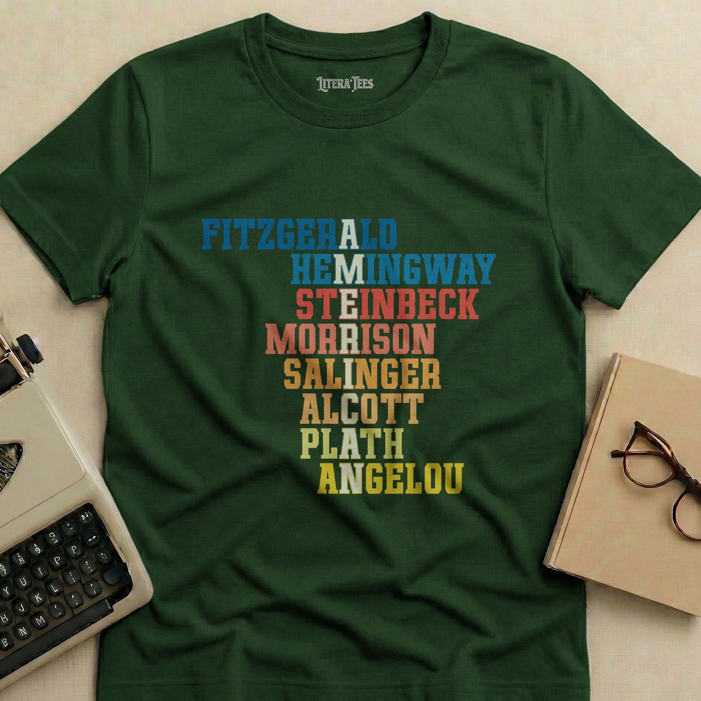 Dark green t-shirt with author names in colorful block letters.