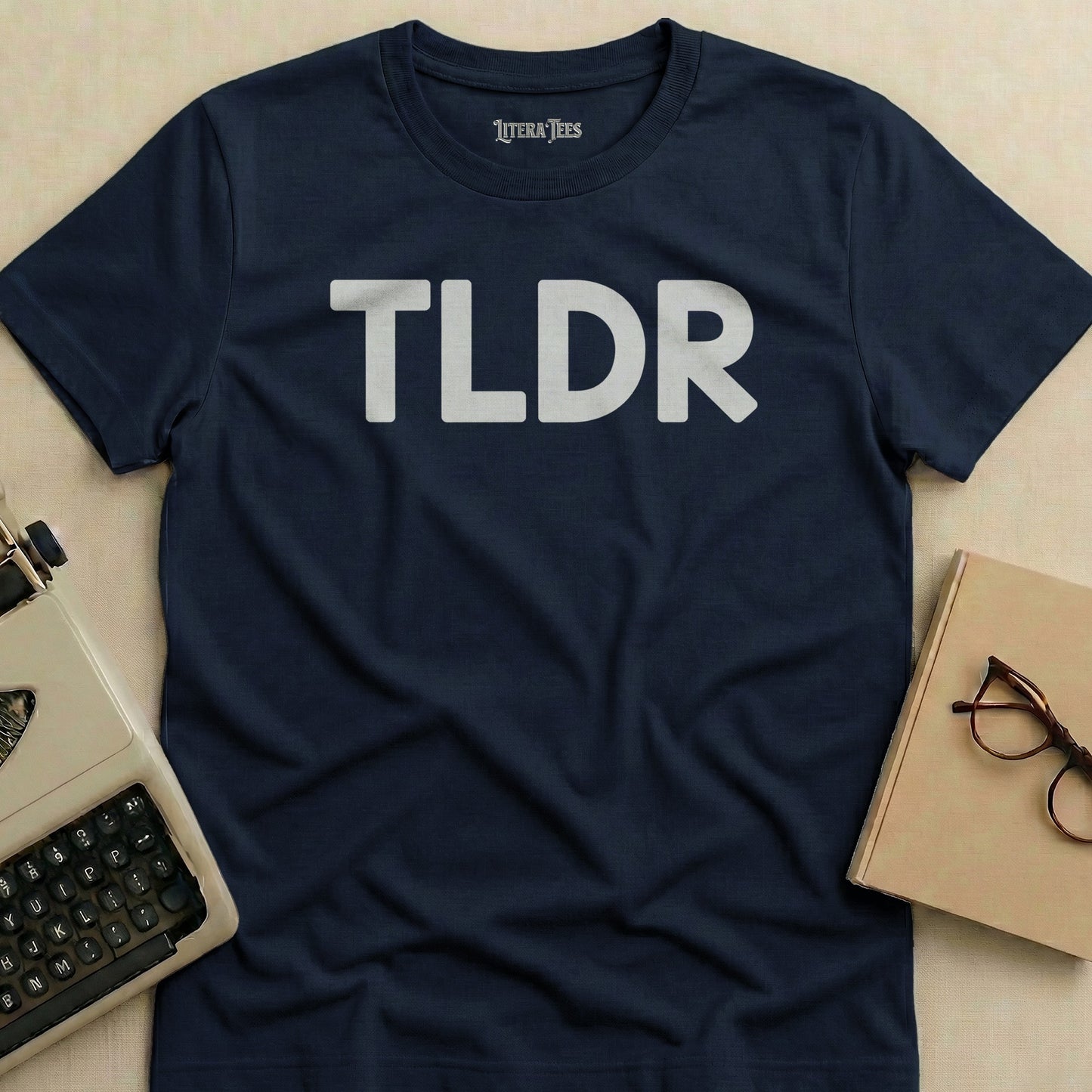 Navy t-shirt with white "TLDR" text and "LITERA TEES" logo.