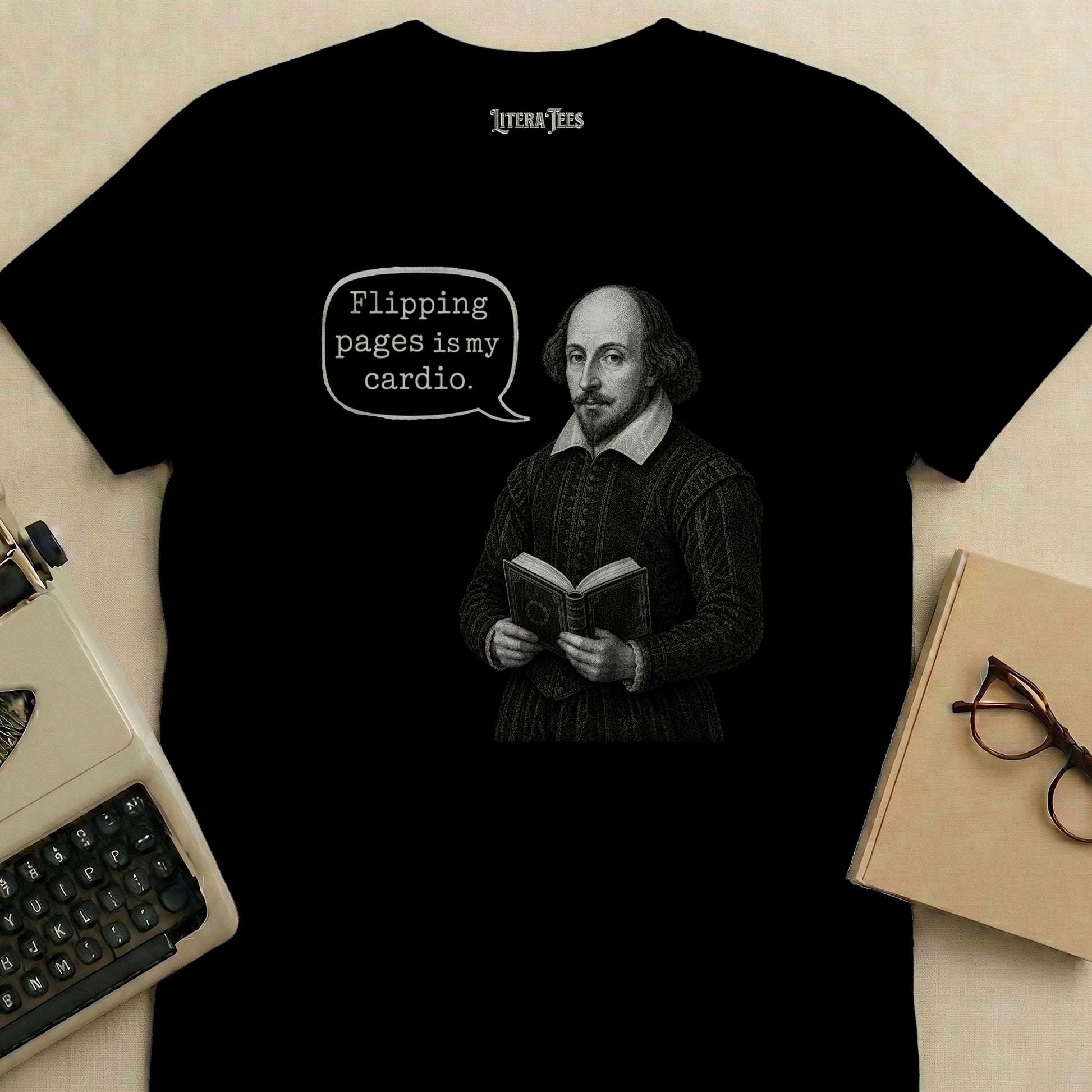Black t-shirt graphic with Shakespeare holding a book and a speech bubble saying "Flipping pages is my cardio."