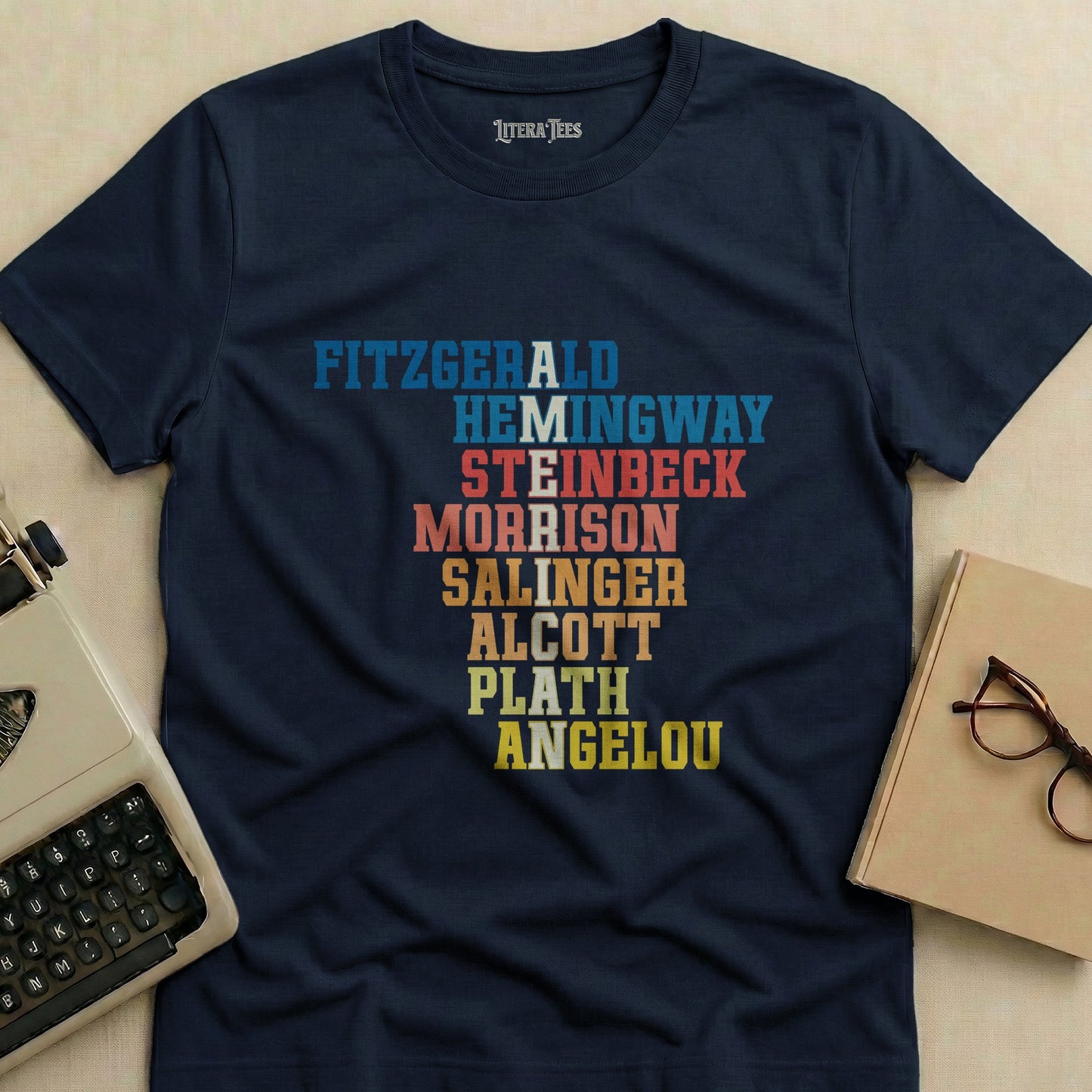 Navy t-shirt with classic authors' names in colorful block letters.