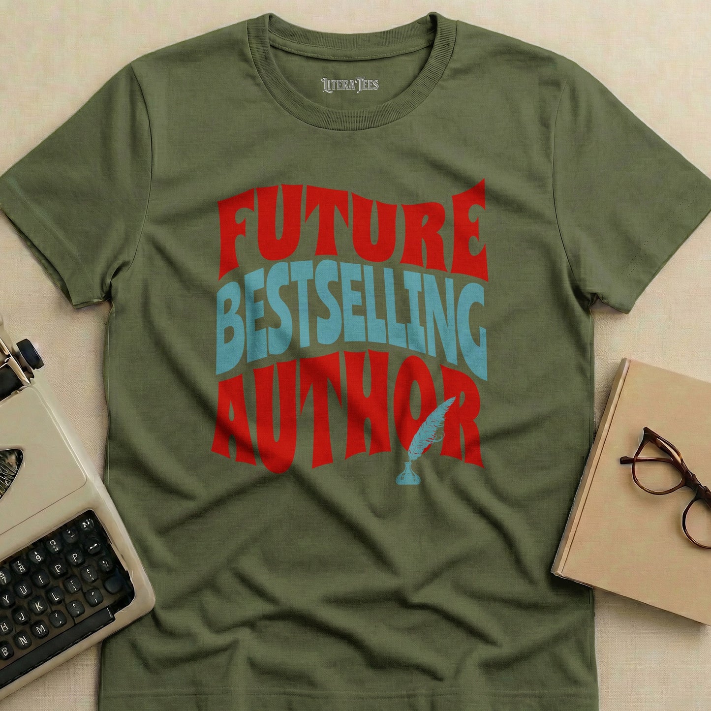 Olive green t-shirt with "FUTURE BESTSELLING AUTHOR" in red and blue lettering.