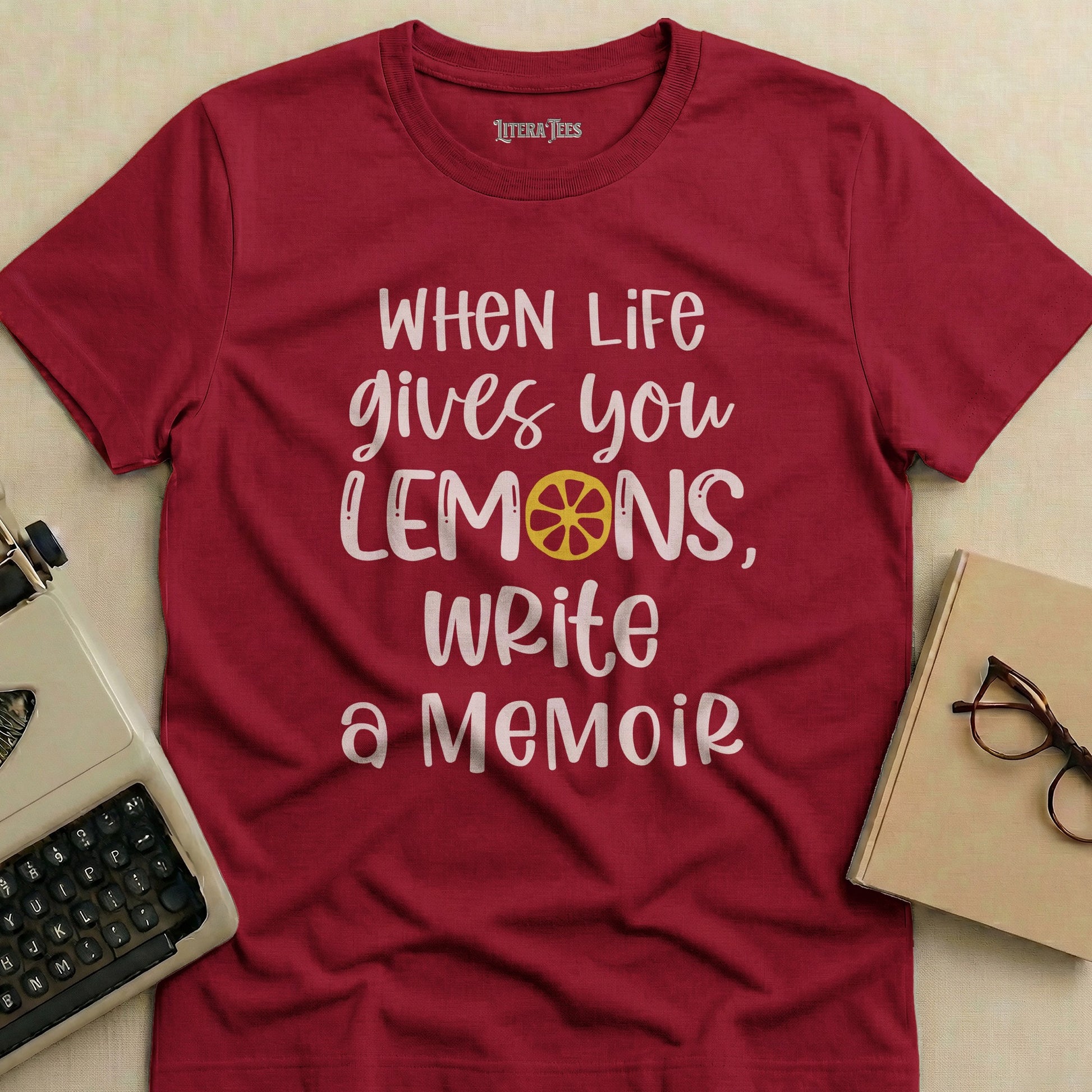 Maroon t-shirt with "When Life Gives You Lemons, Write a Memoir" text.