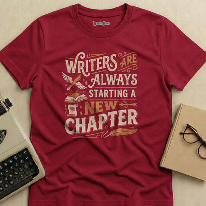 Maroon t-shirt with "Writers Are Always Starting a New Chapter" text and illustrations.