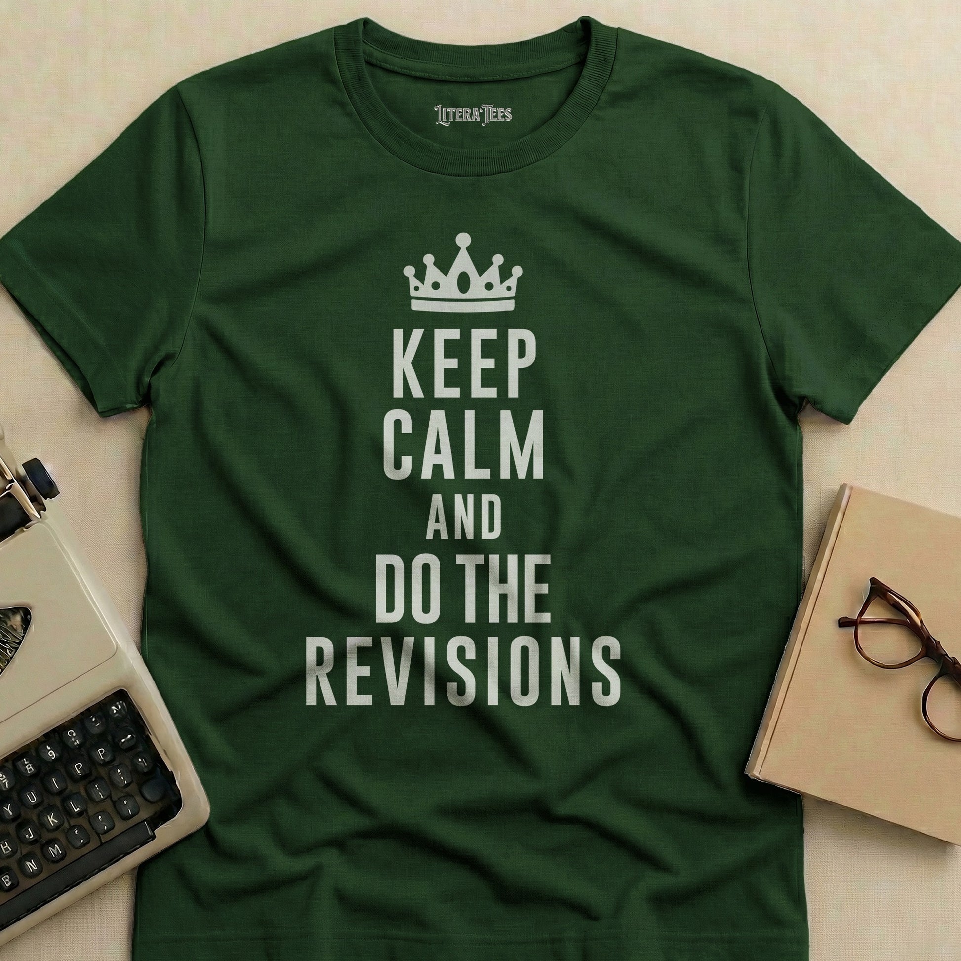 Green t-shirt with "Keep Calm and Do the Revisions" text and crown graphic.