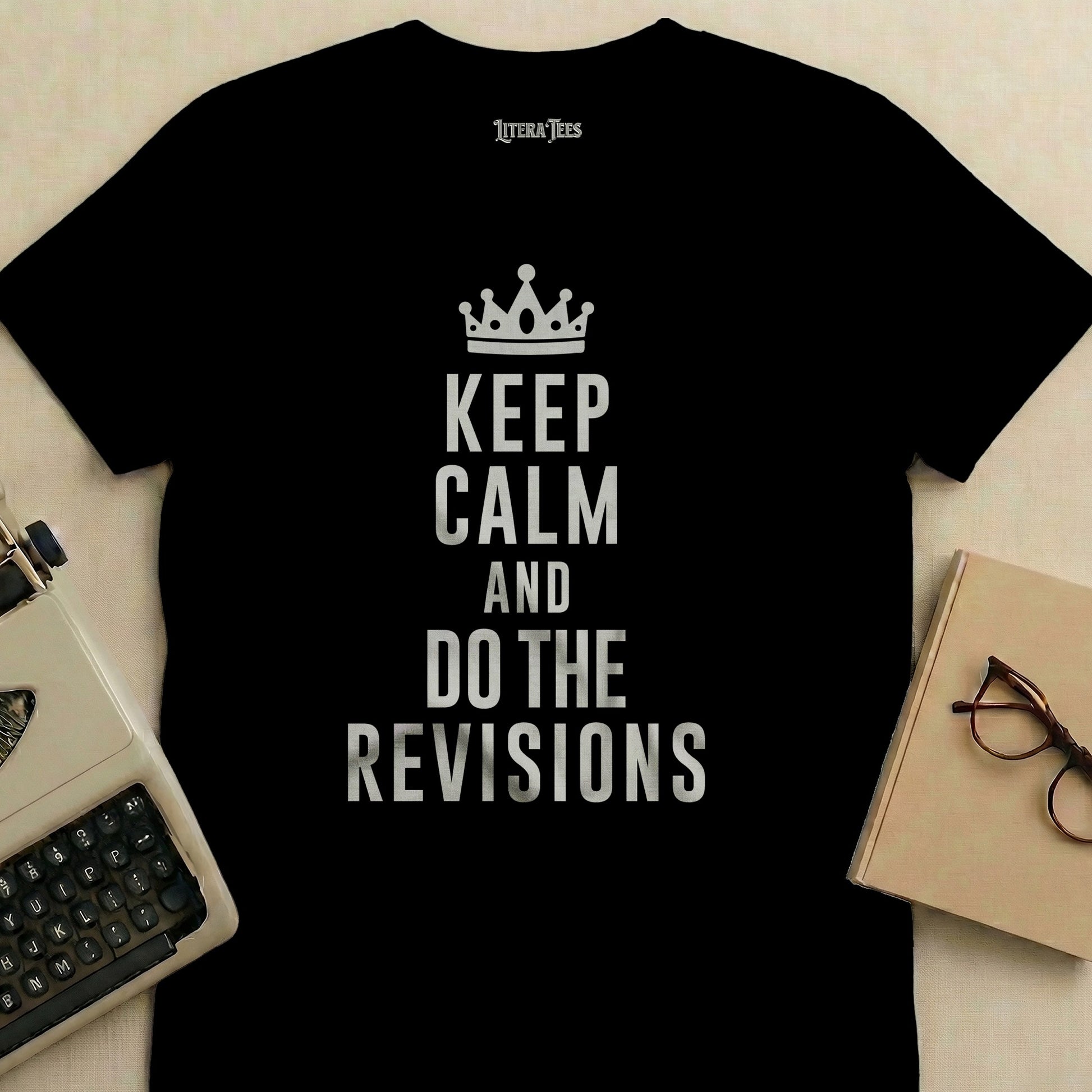 Black t-shirt with "Keep Calm and Do the Revisions" text and crown graphic.