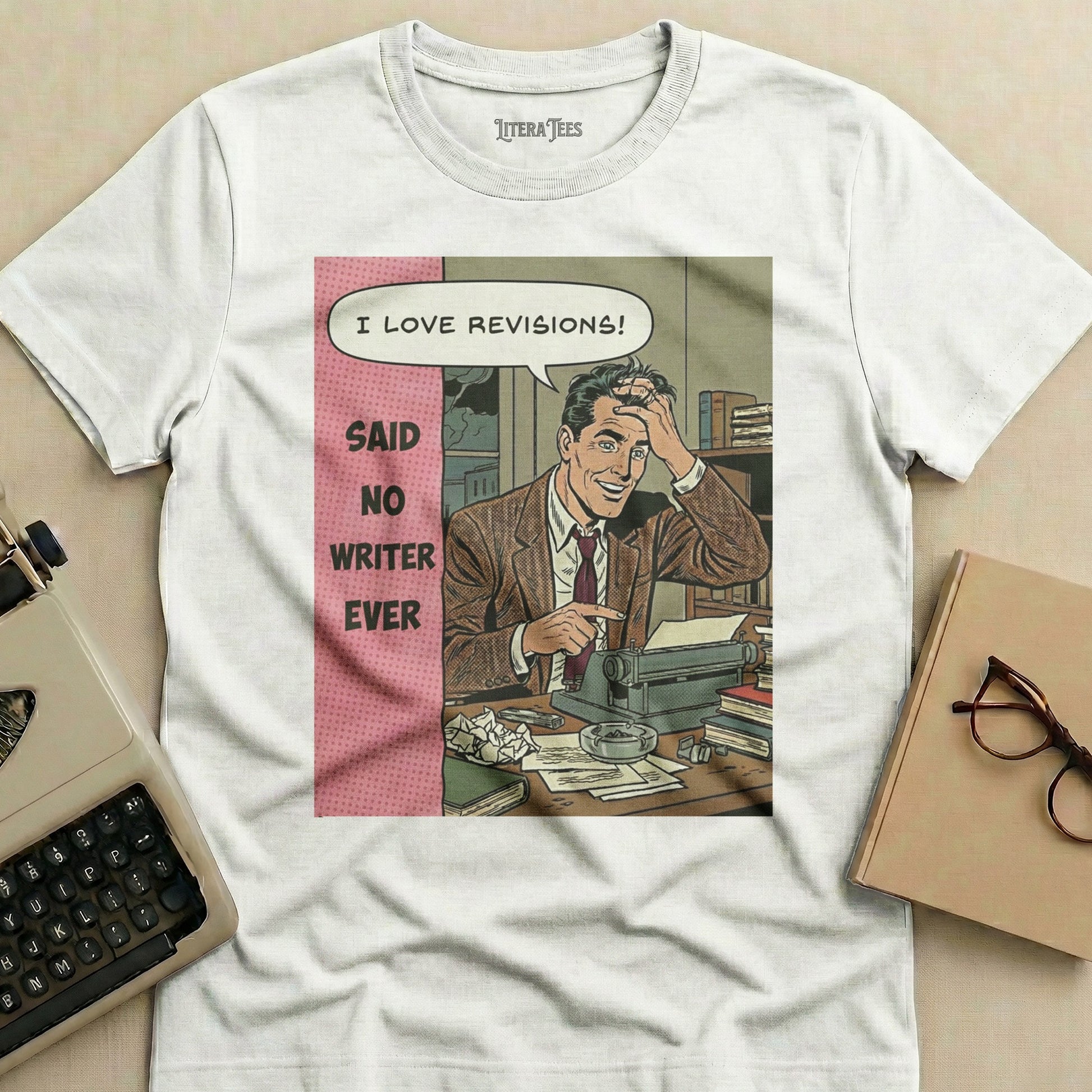 T-shirt with a comic panel of a man at a typewriter saying "I LOVE REVISIONS! SAID NO WRITER EVER".