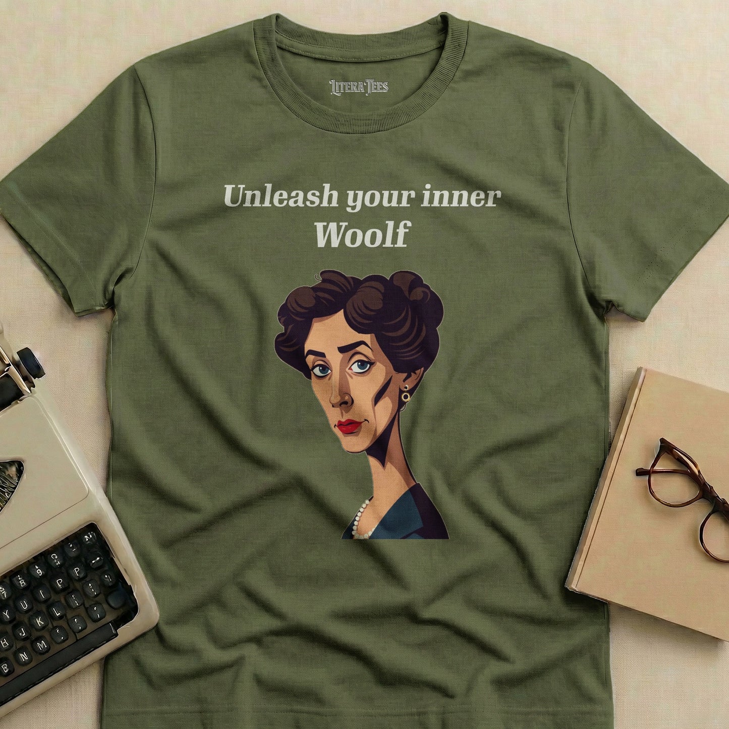 Olive green t-shirt with "Unleash your inner Woolf" and a portrait of Virginia Woolf.