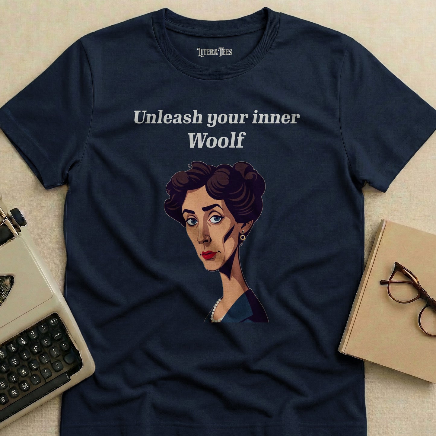Navy t-shirt with "Unleash your inner Woolf" text and Virginia Woolf illustration.