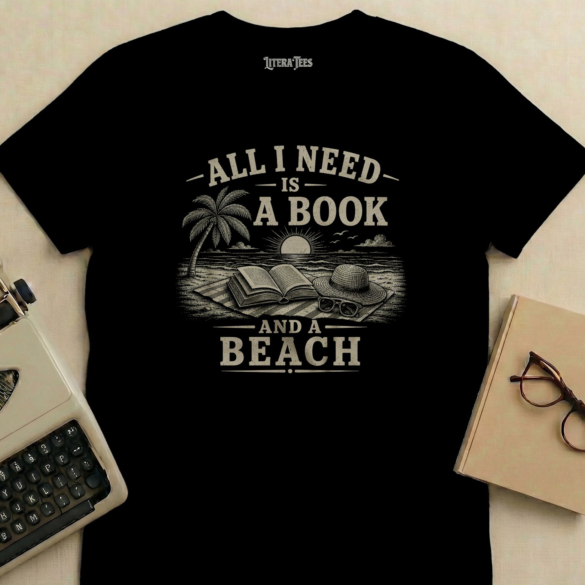 T-shirt with "All I need is a book and a beach" text and beach scene.