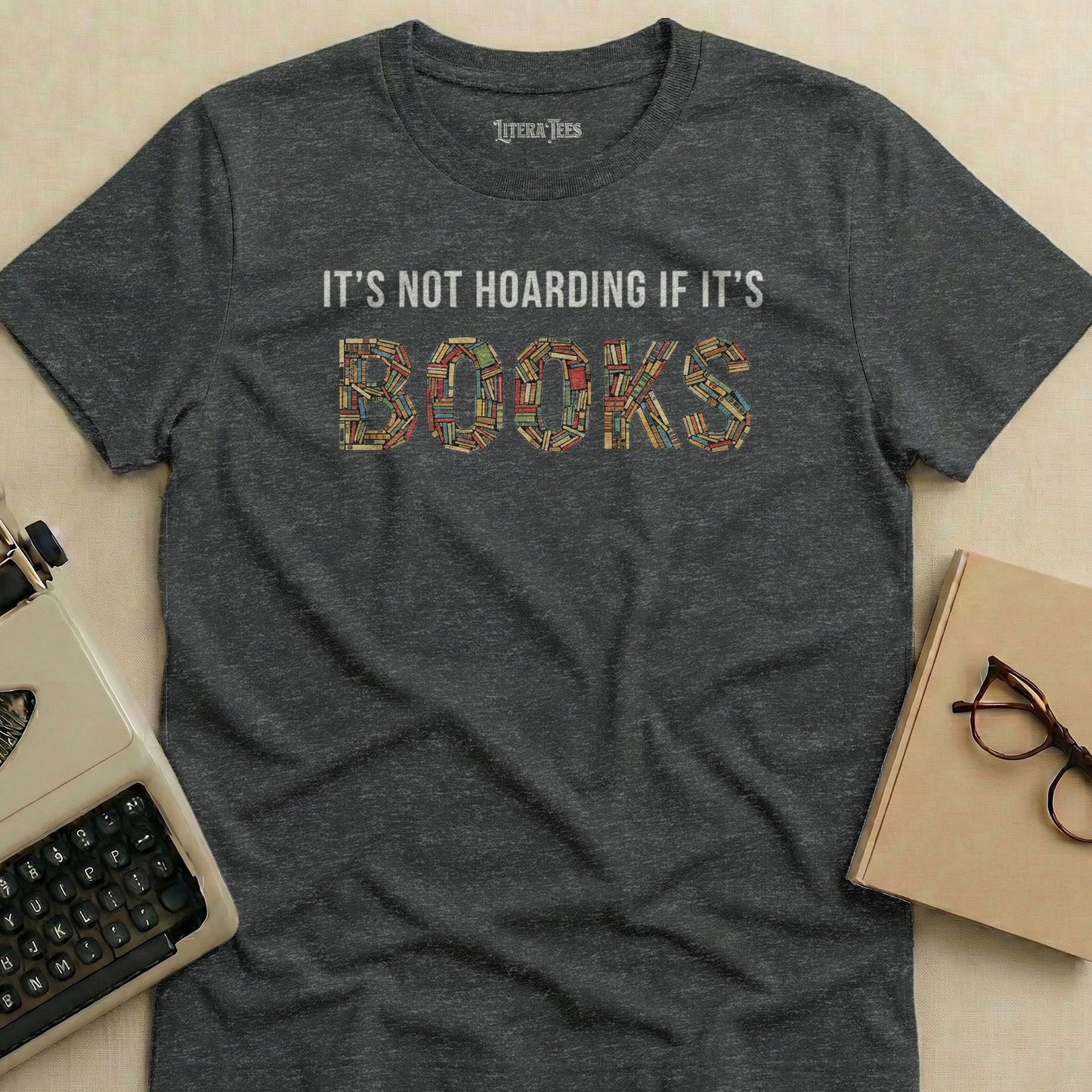 Dark gray t-shirt with "IT'S NOT HOARDING IF IT'S BOOKS" text.