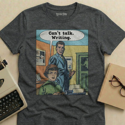 T-shirt with comic panel art and text "Can't talk. Writing."