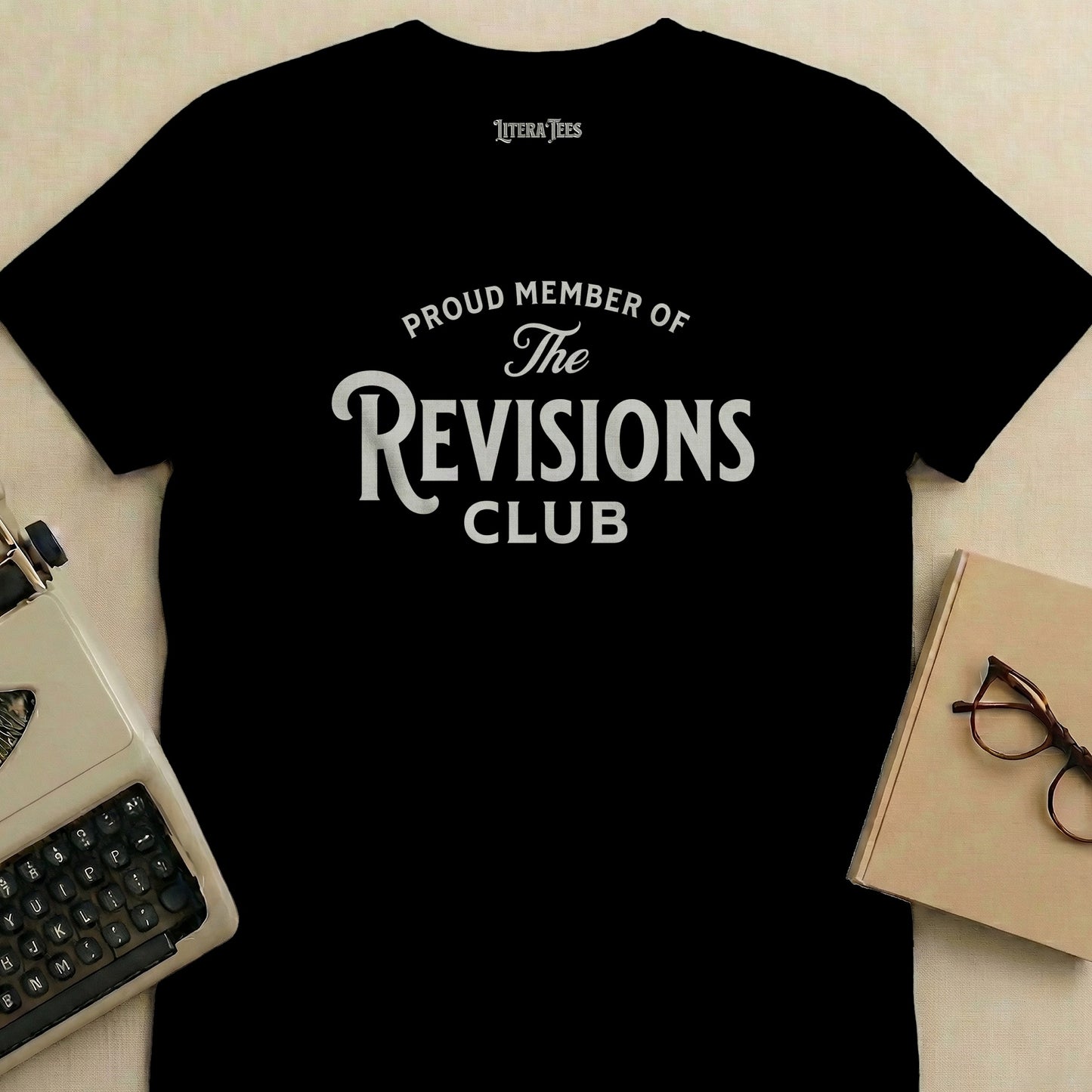 Black t-shirt with "Proud Member of The Revisions Club" text.
