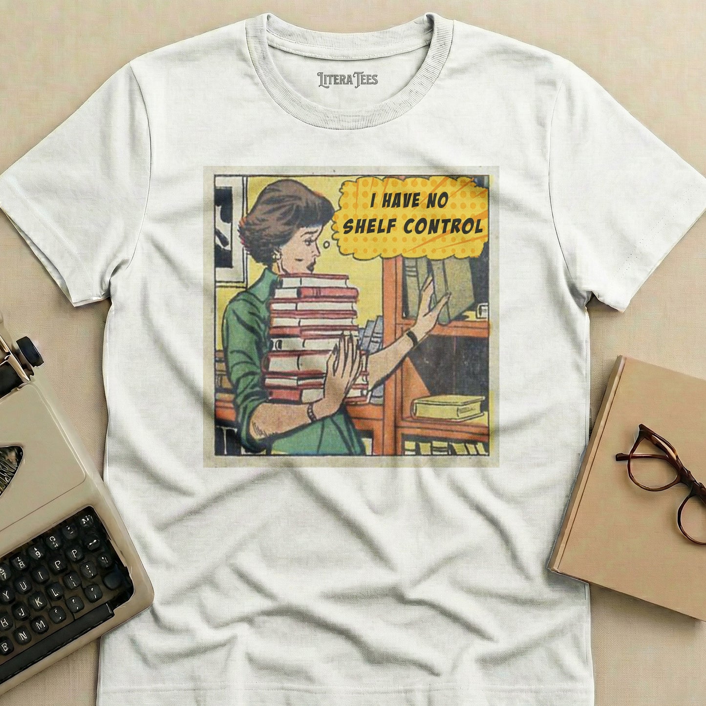 T-shirt with cartoon woman holding books and text "I HAVE NO SHELF CONTROL".