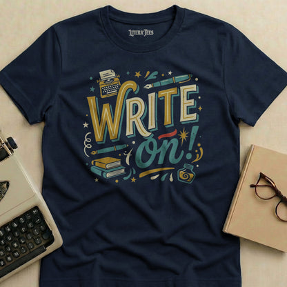 Navy t-shirt with "WRITE on!" text, typewriter, books, and inkwell design.