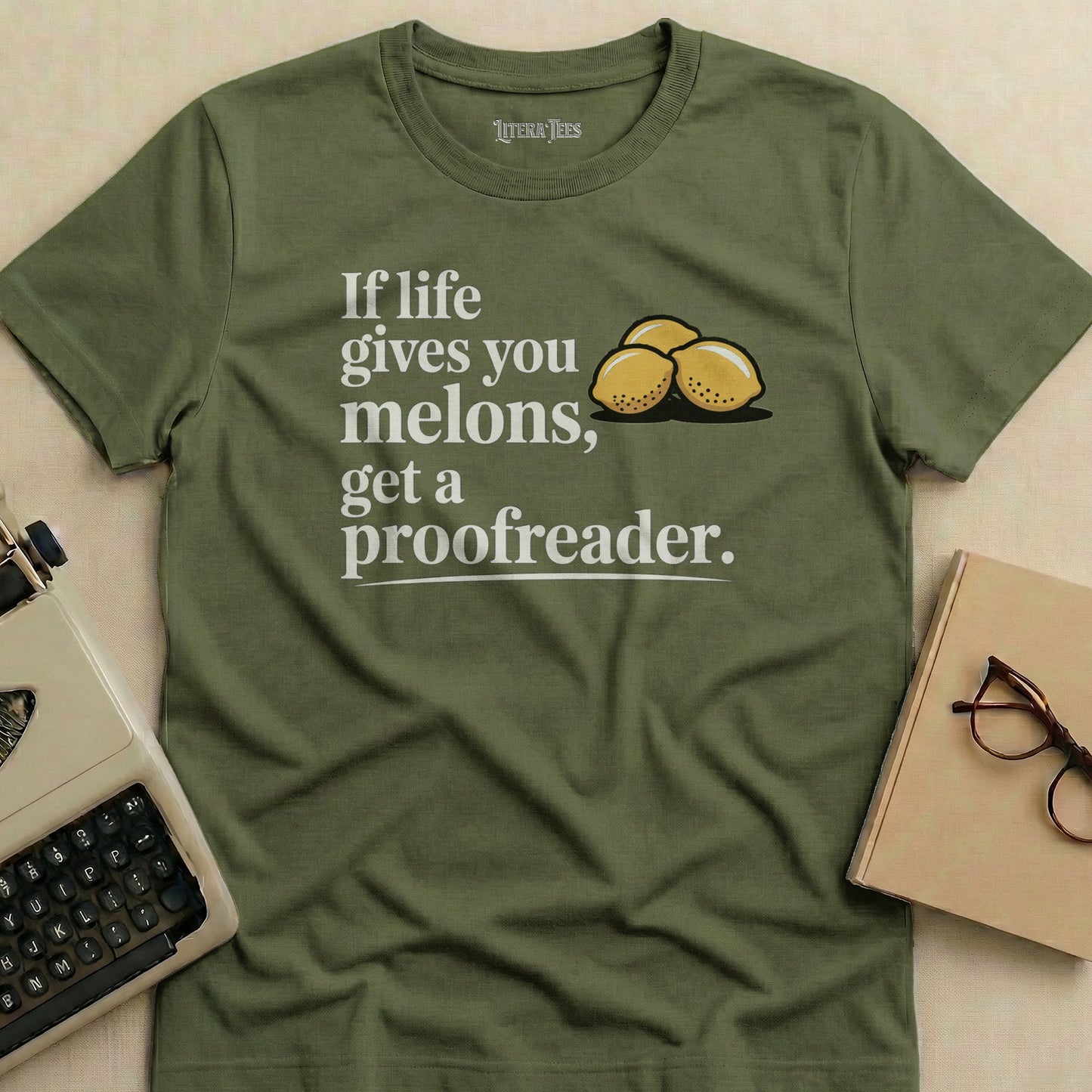 Olive green t-shirt with "If life gives you melons, get a proofreader."