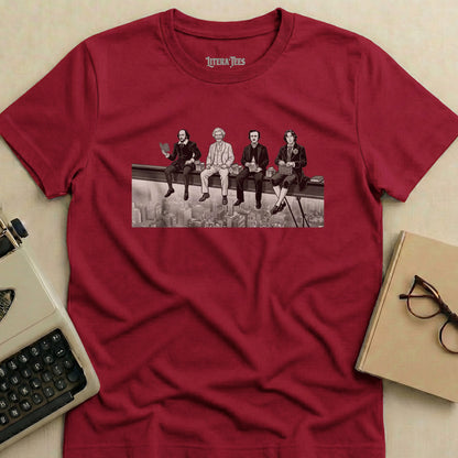 T-shirt with print of four historical figures sitting on a beam, overlooking a city.