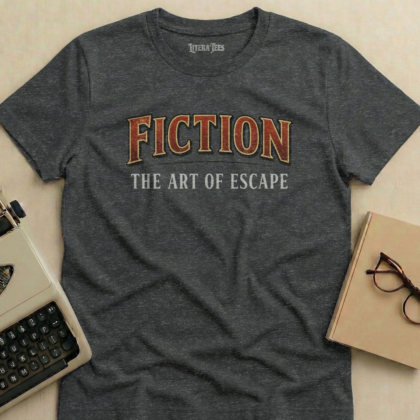 Dark grey t-shirt with "FICTION THE ART OF ESCAPE" text.