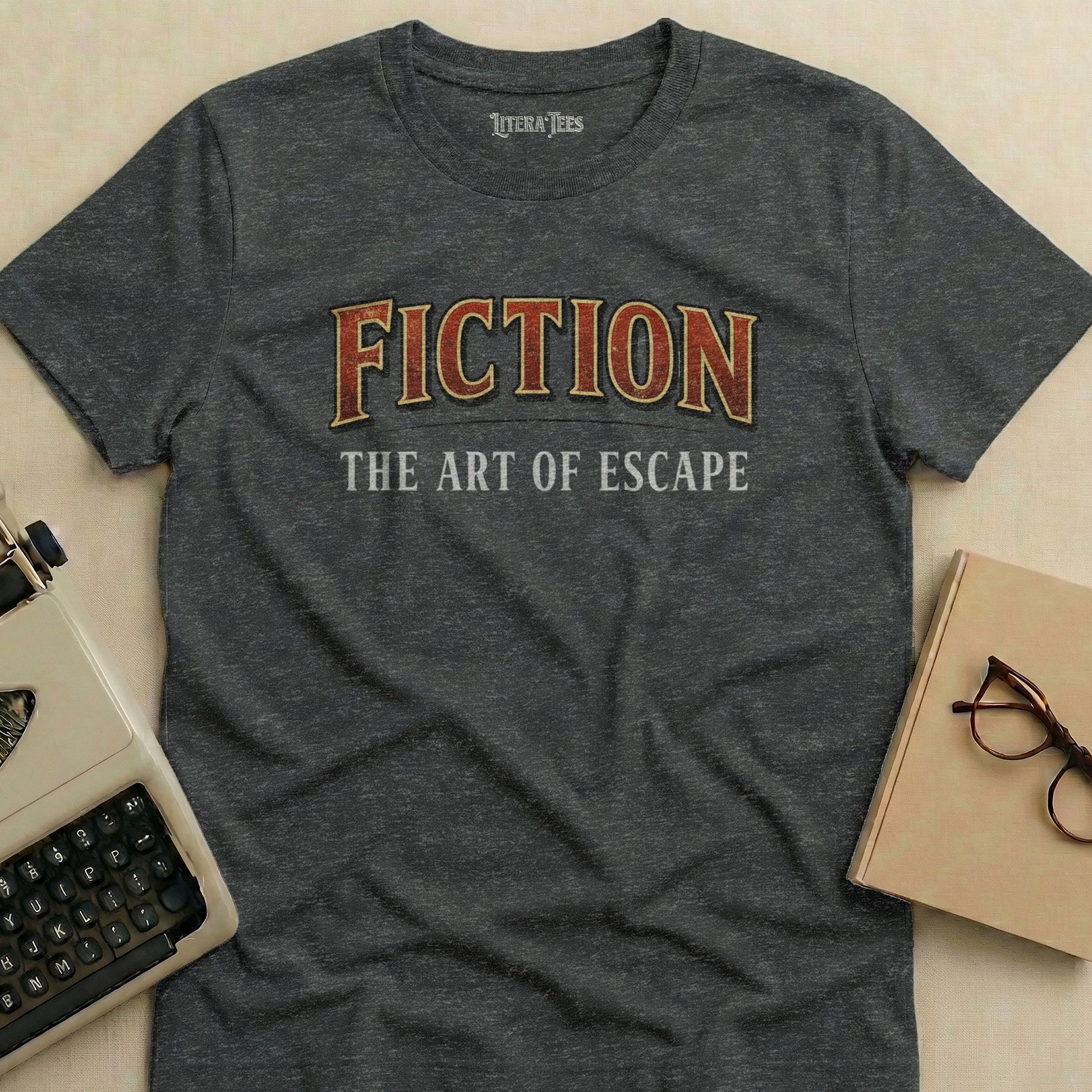 Dark grey t-shirt with "FICTION THE ART OF ESCAPE" text.