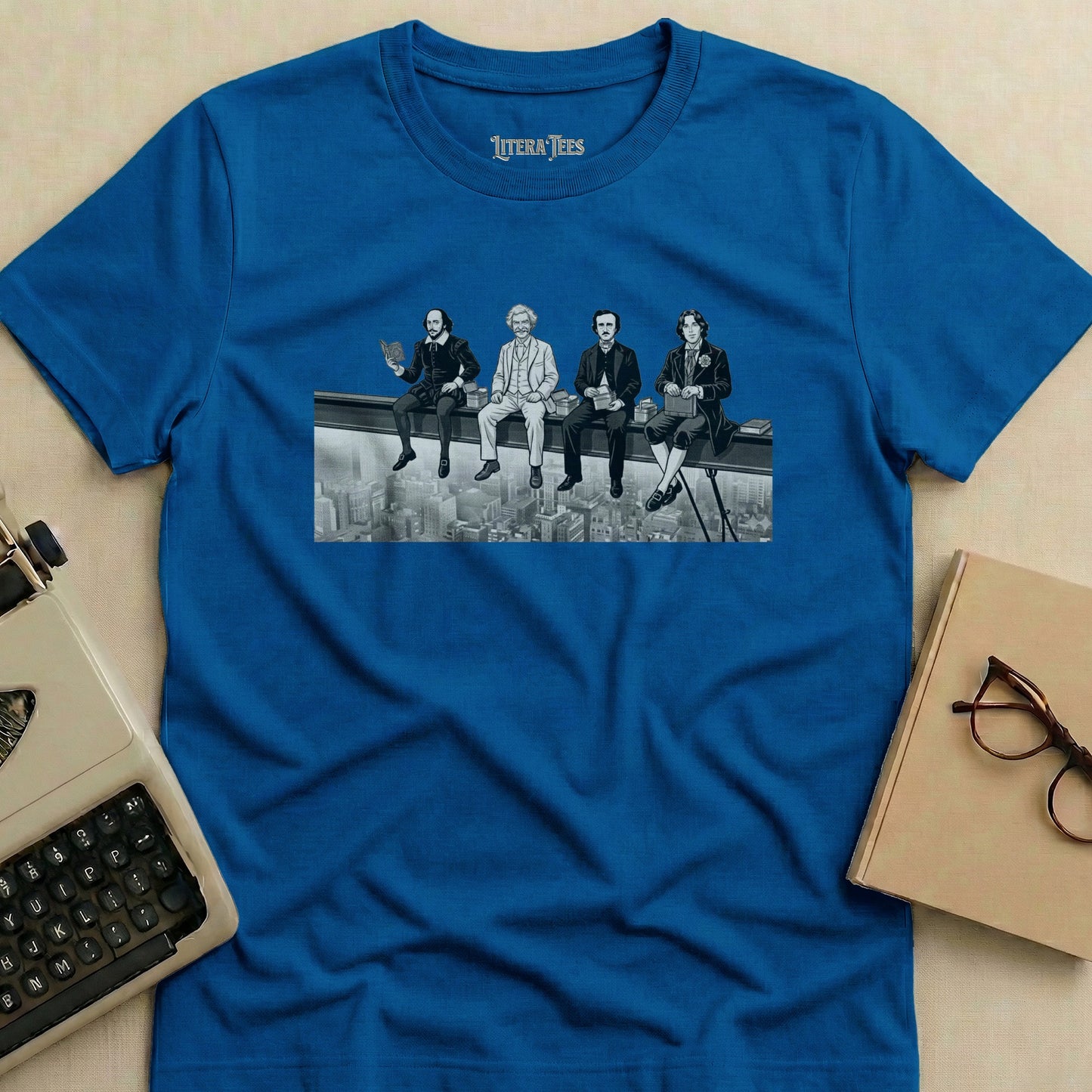Four historical figures sit on a beam overlooking a city on a blue t-shirt.