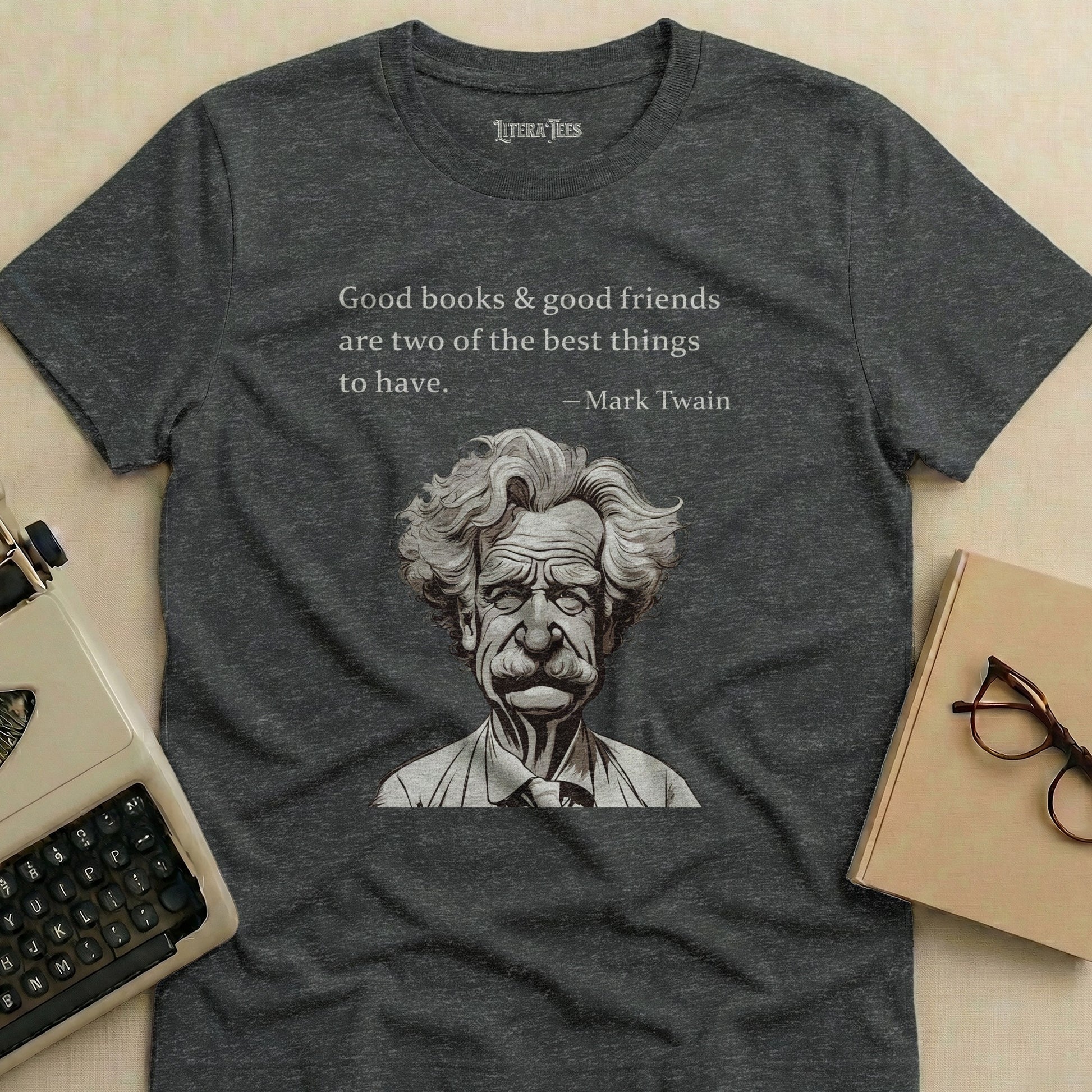 Dark gray t-shirt with Mark Twain portrait and quote "Good books & good friends are two of the best things to have. - Mark Twain".