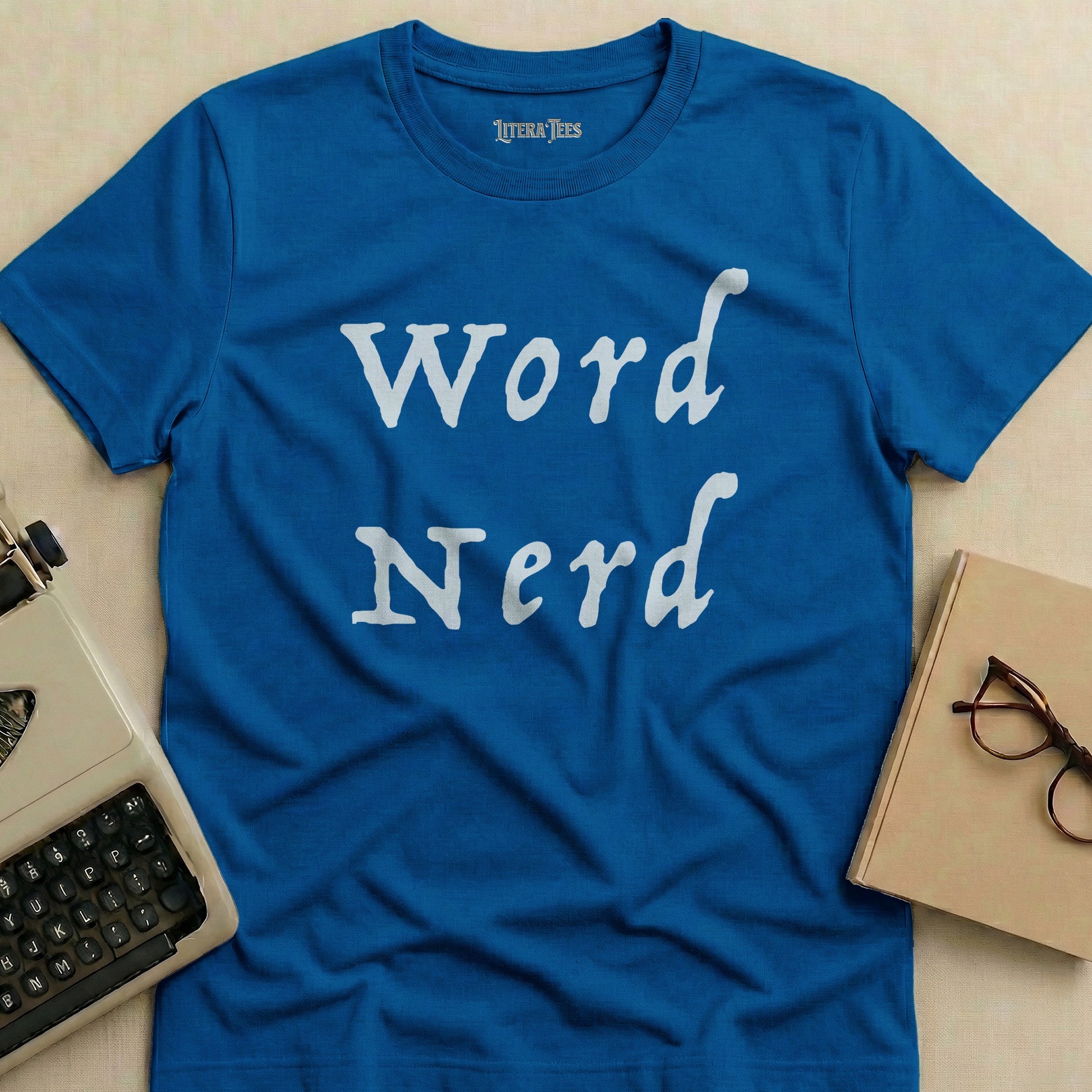 Blue t-shirt with "Word Nerd" in white stylized text.