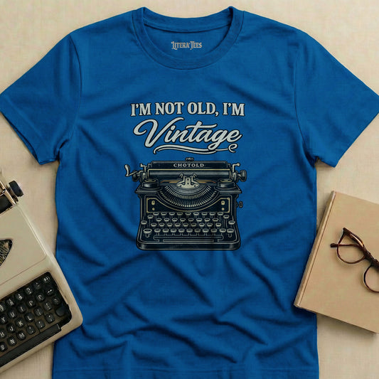 Blue t-shirt with "I'M NOT OLD, I'M Vintage" and a typewriter graphic.
